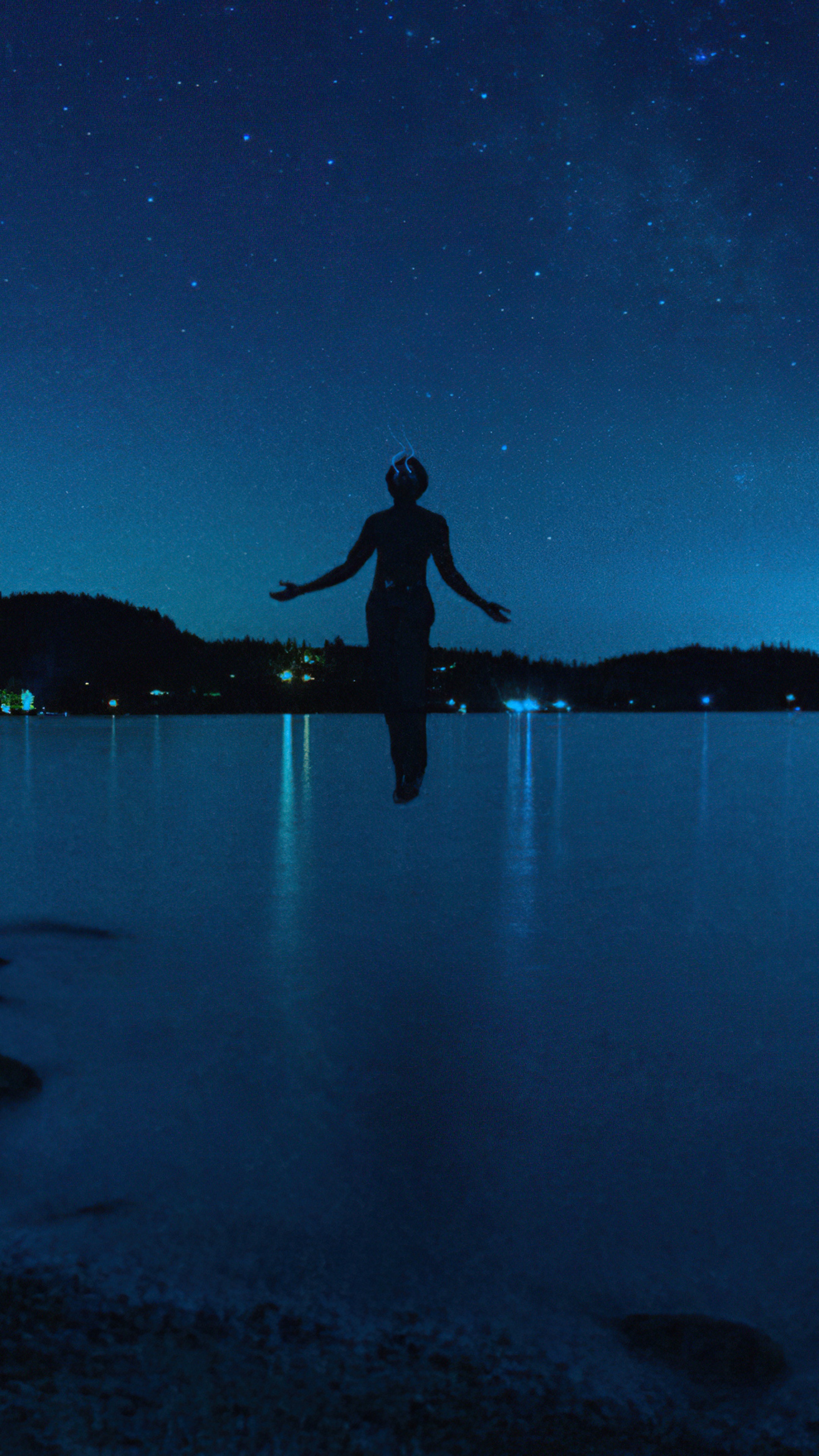 Silhouette of a person under a starry sky HD Phone Wallpaper