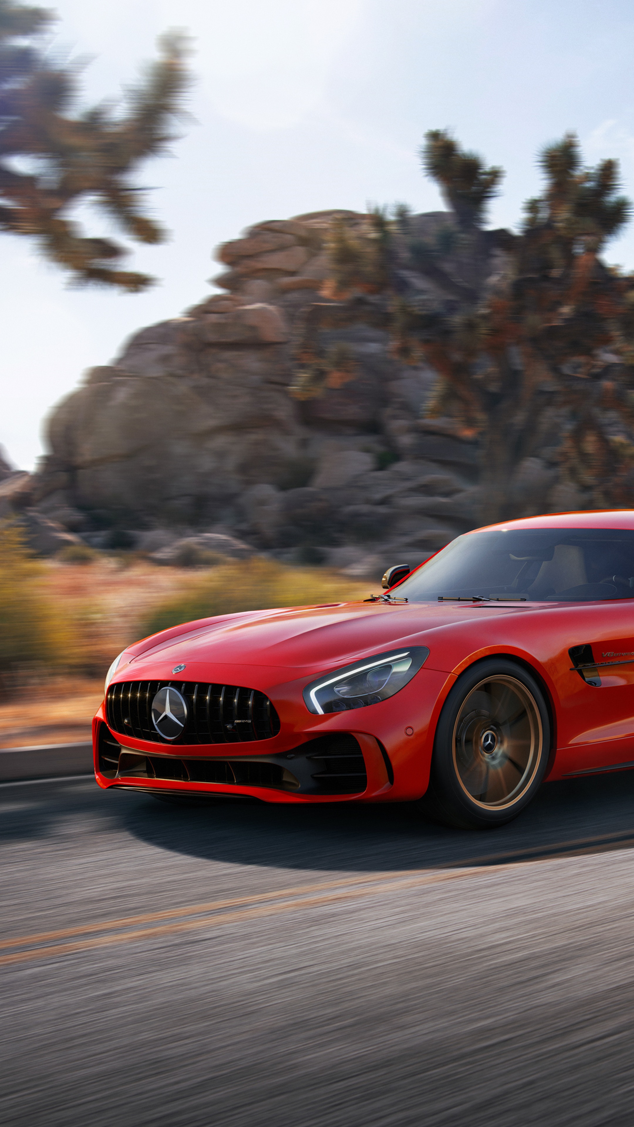 Red Mercedes-AMG GT R driving on a desert road HD Phone Wallpaper