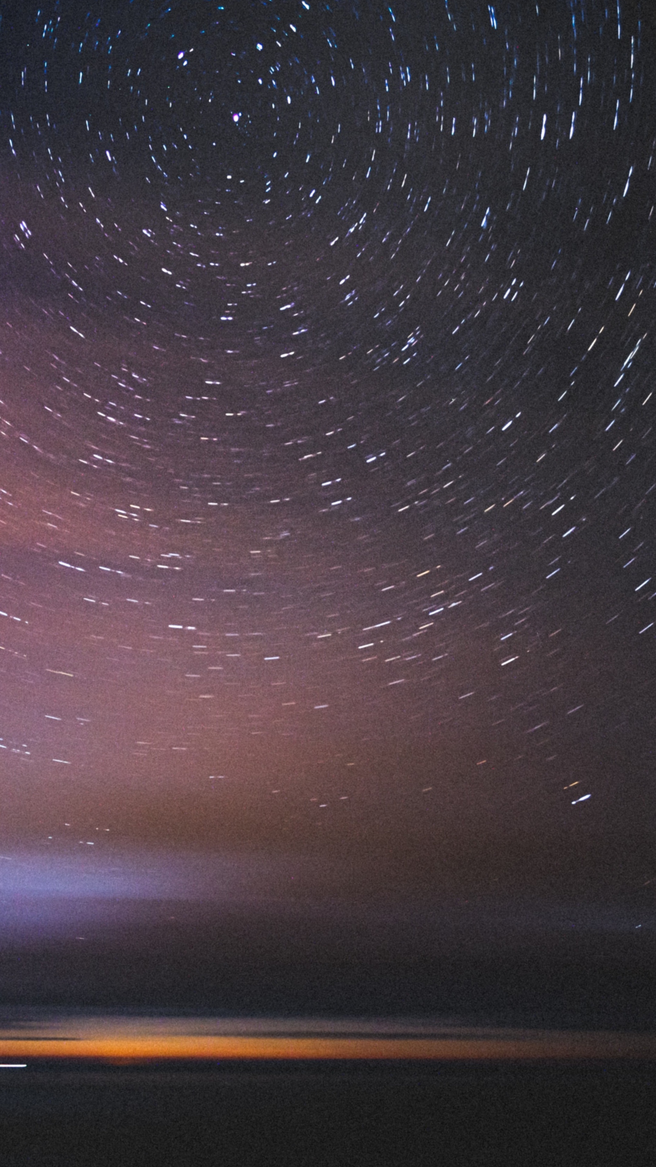 Star trails over a dark landscape and ocean HD Phone Wallpaper