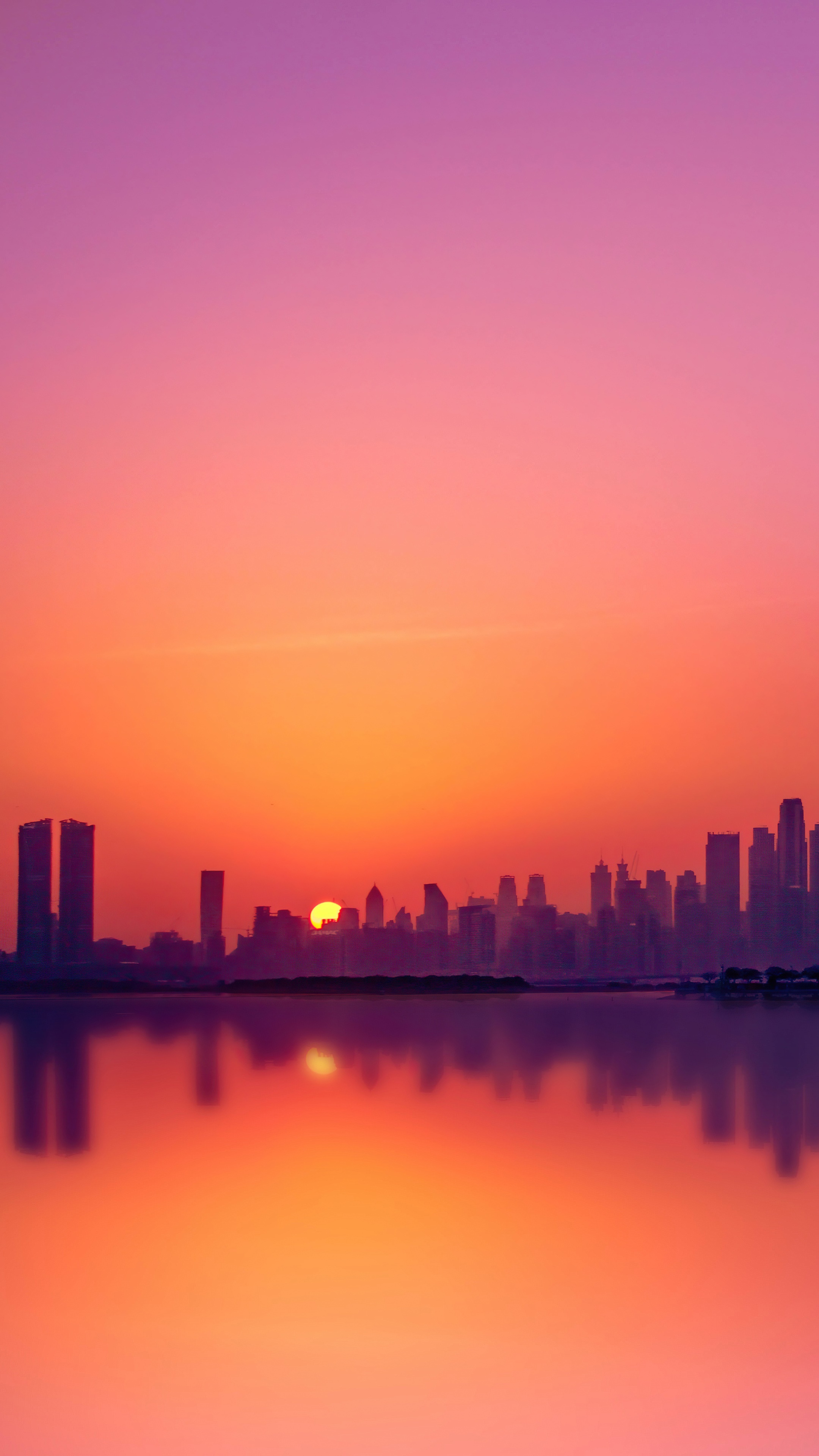 Dubai skyline at sunset over the water HD Phone Wallpaper