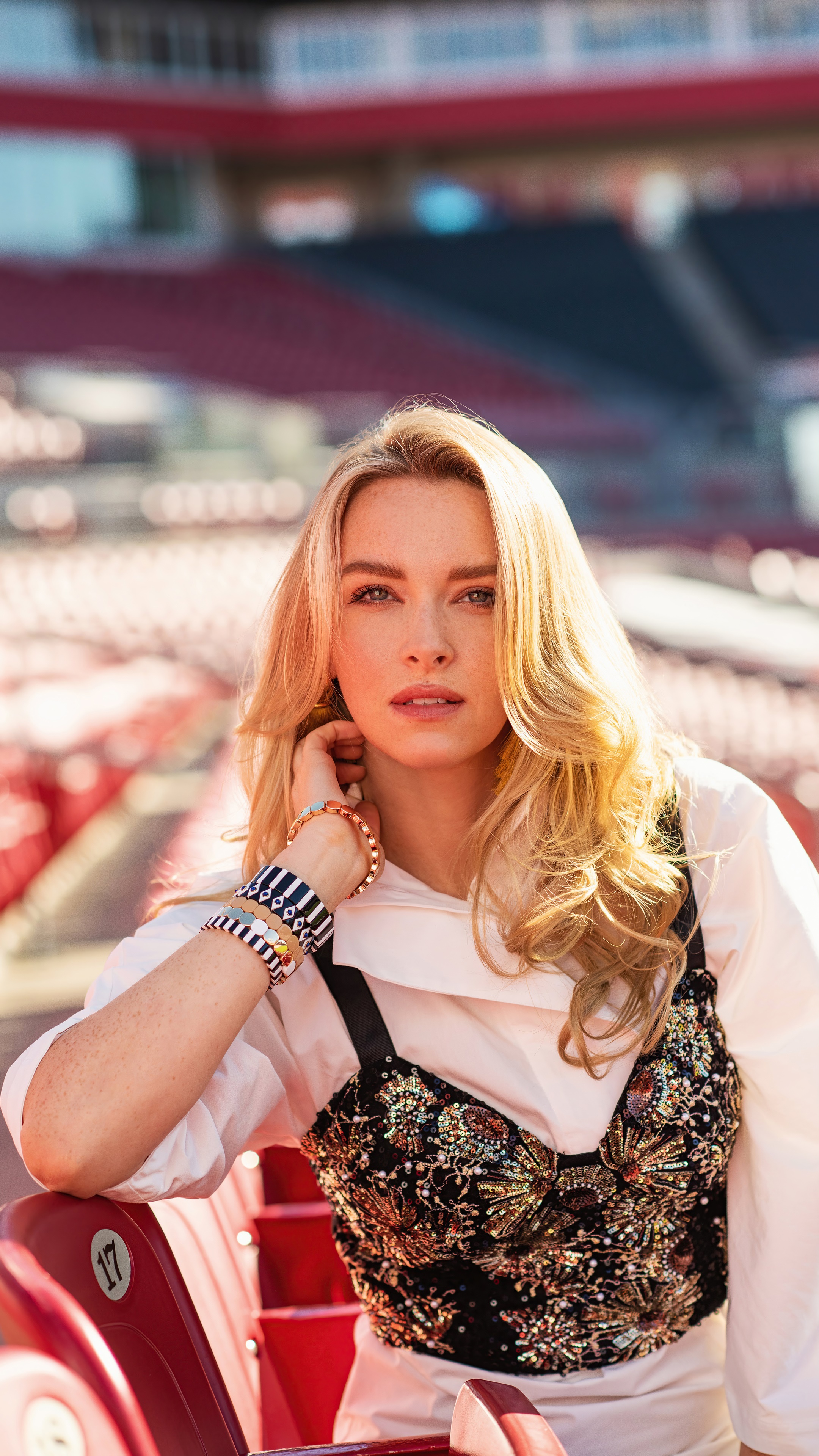 Camille Kostek in stadium seats HD Phone Wallpaper