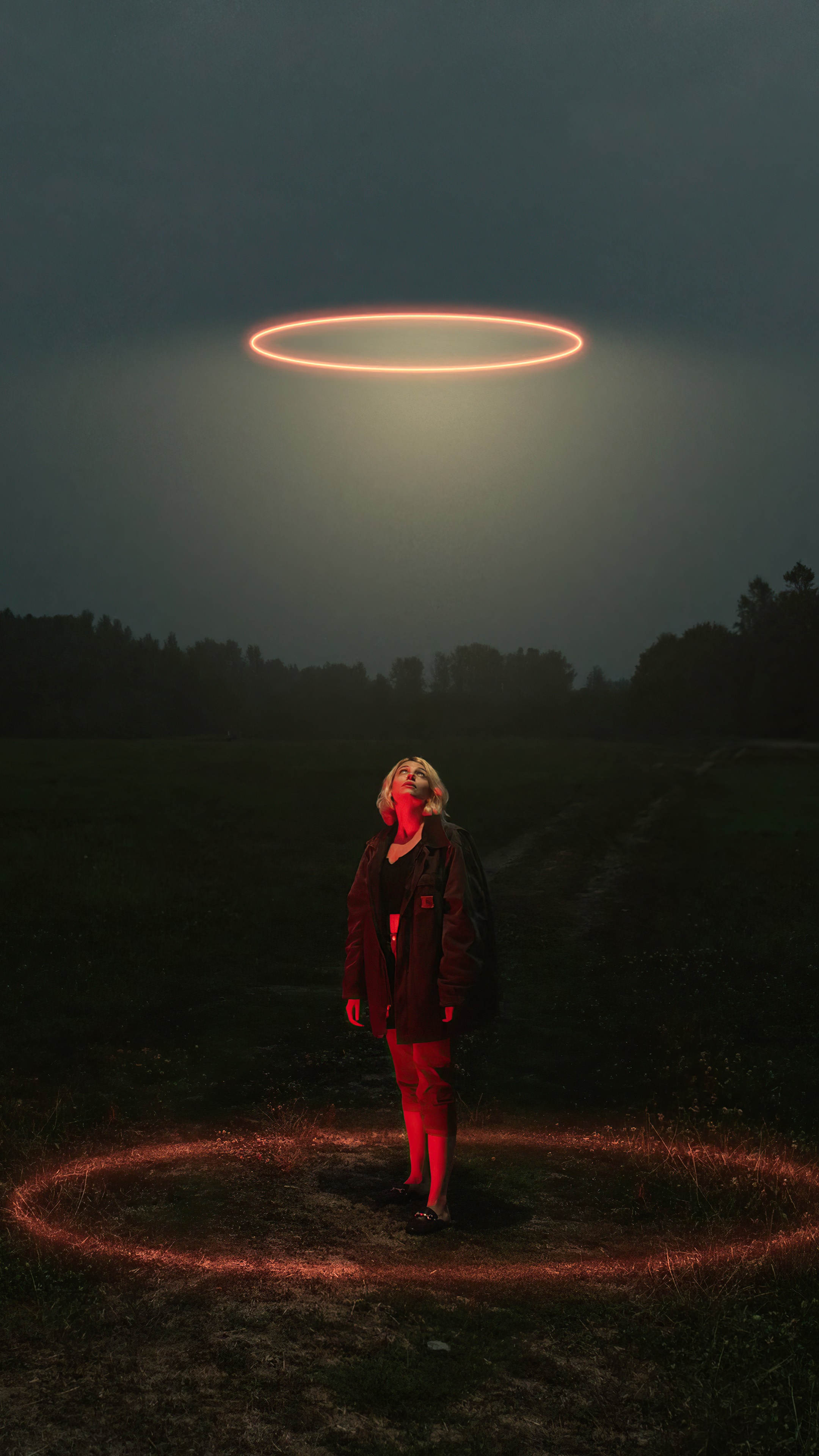 Woman standing in a field with glowing rings HD Phone Wallpaper