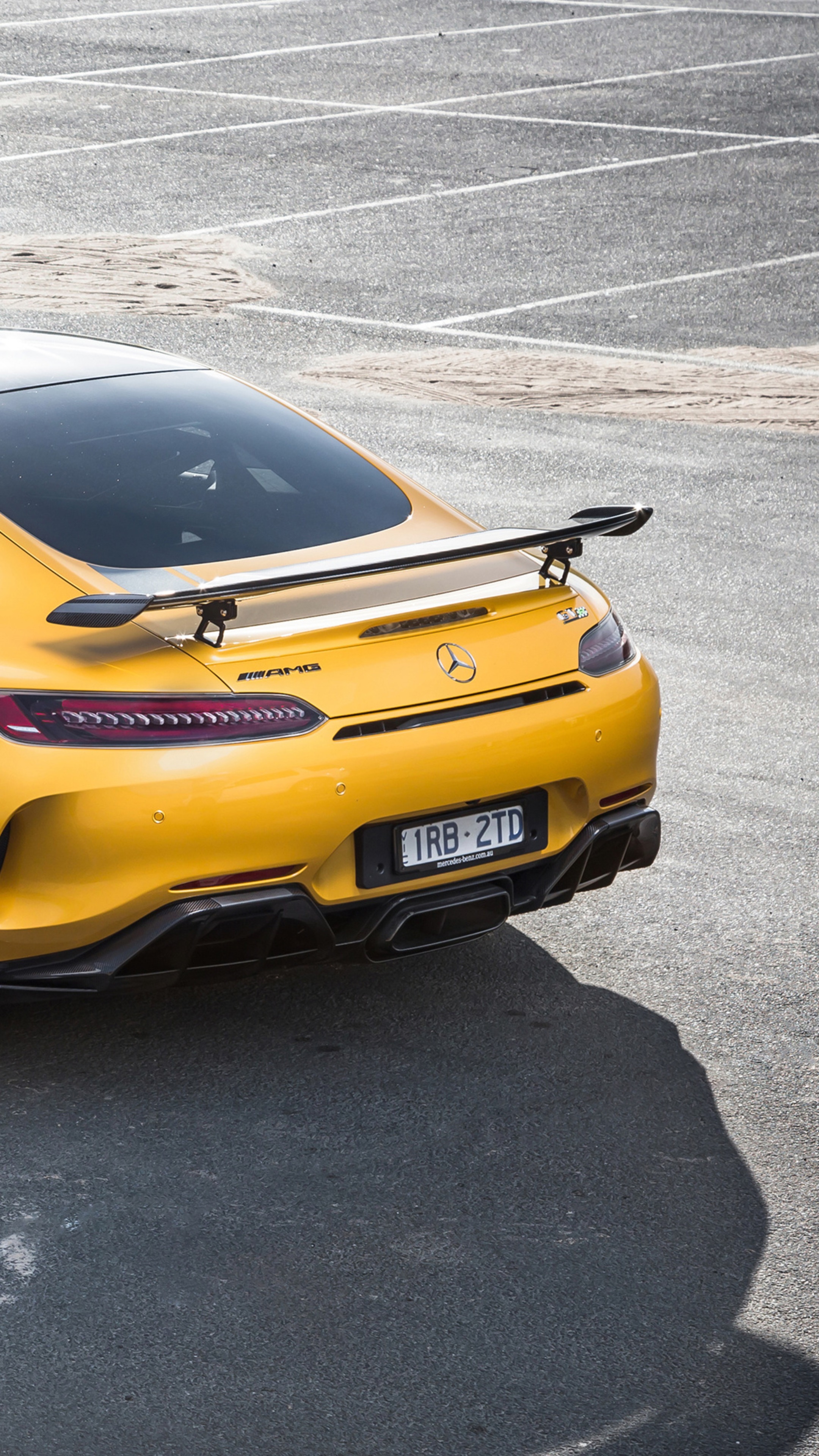 Yellow Mercedes-AMG GT R with spoiler HD Phone Wallpaper