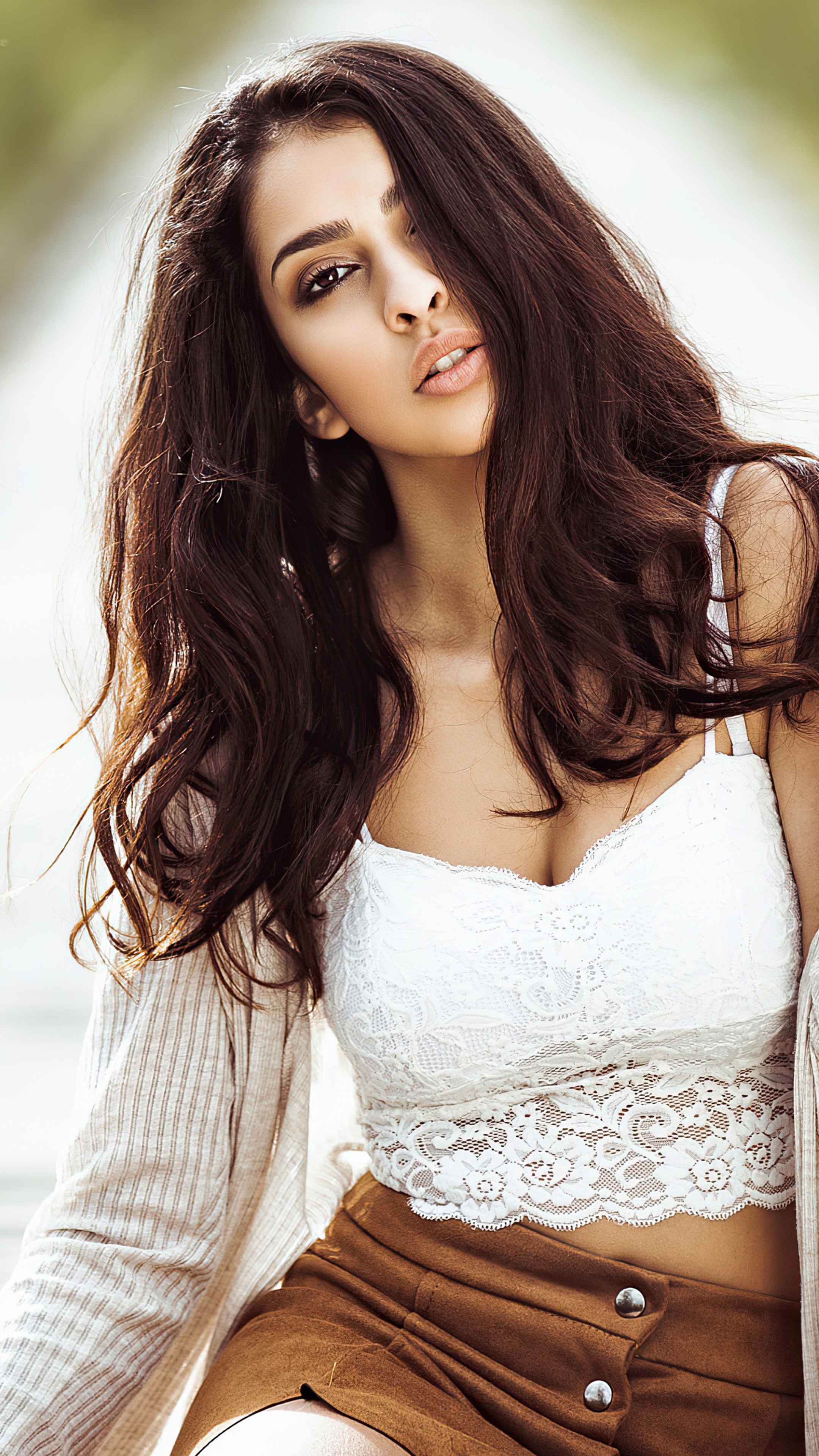Model in white lace crop top and brown skirt HD Phone Wallpaper
