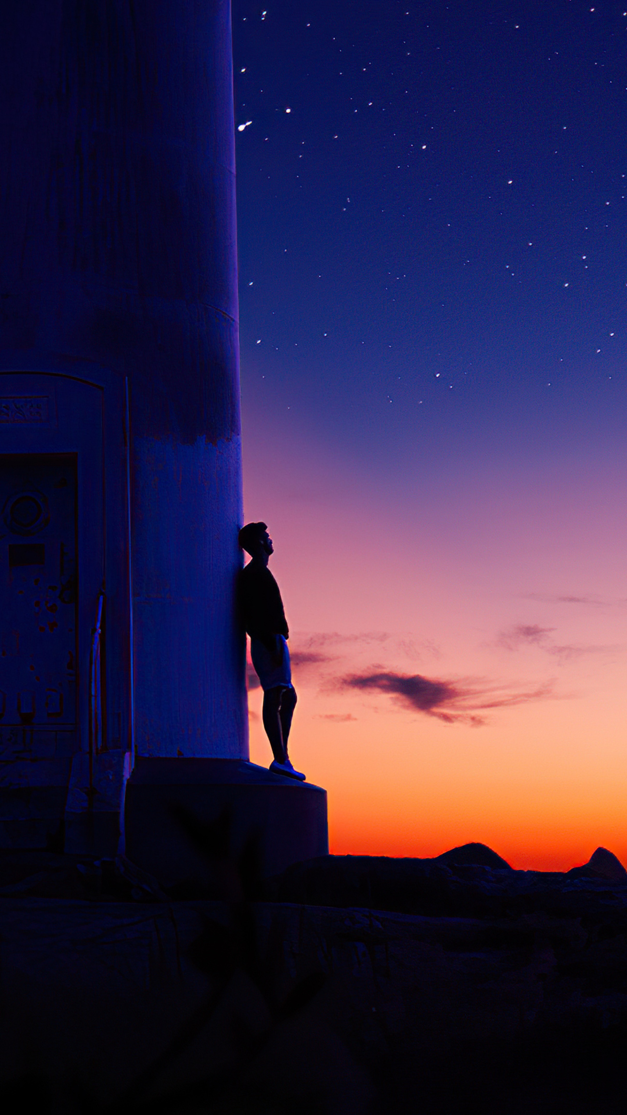 Man leaning on lighthouse at sunset with stars HD Phone Wallpaper