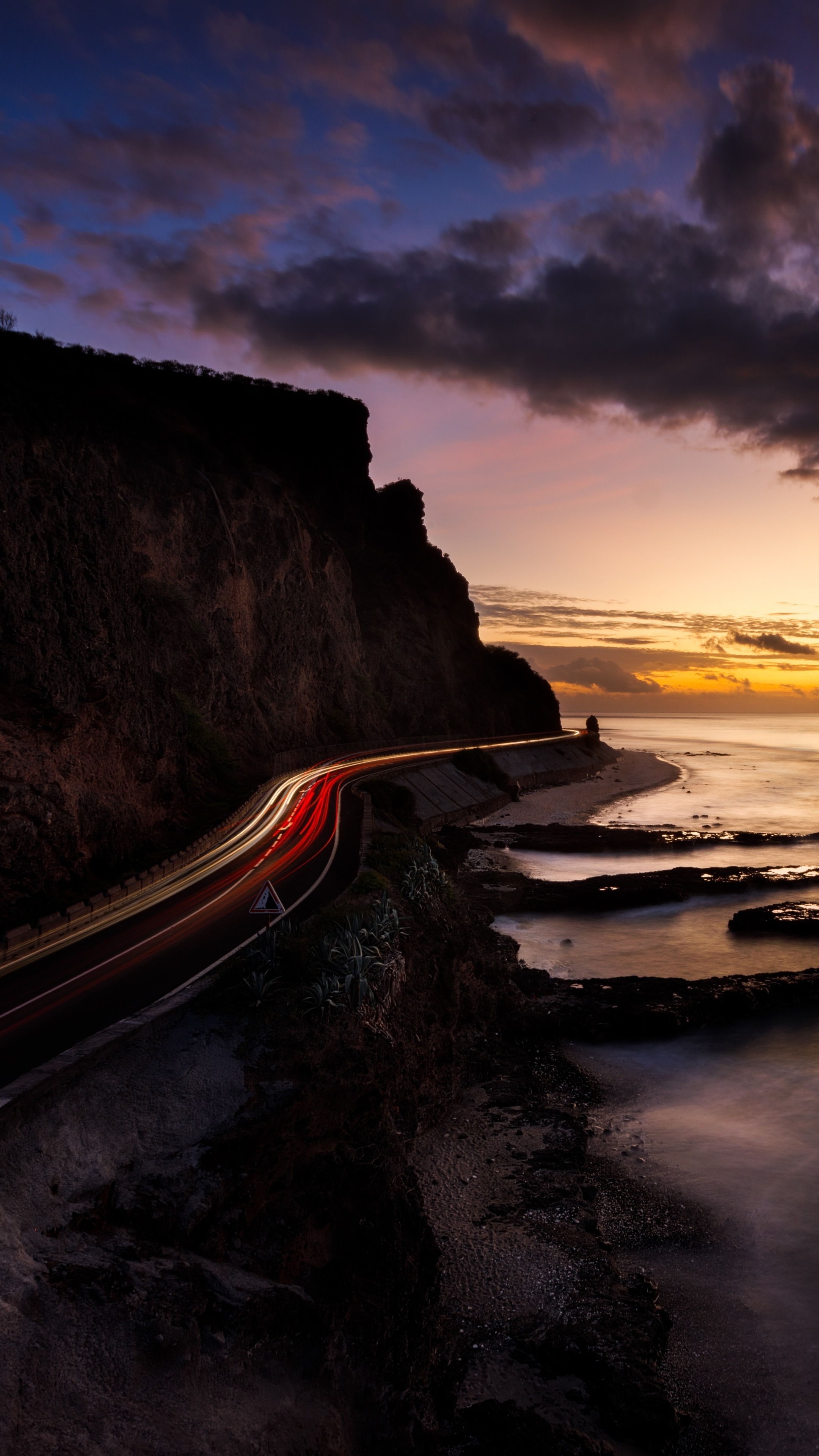 Coastal road at sunset with light trails HD Phone Wallpaper