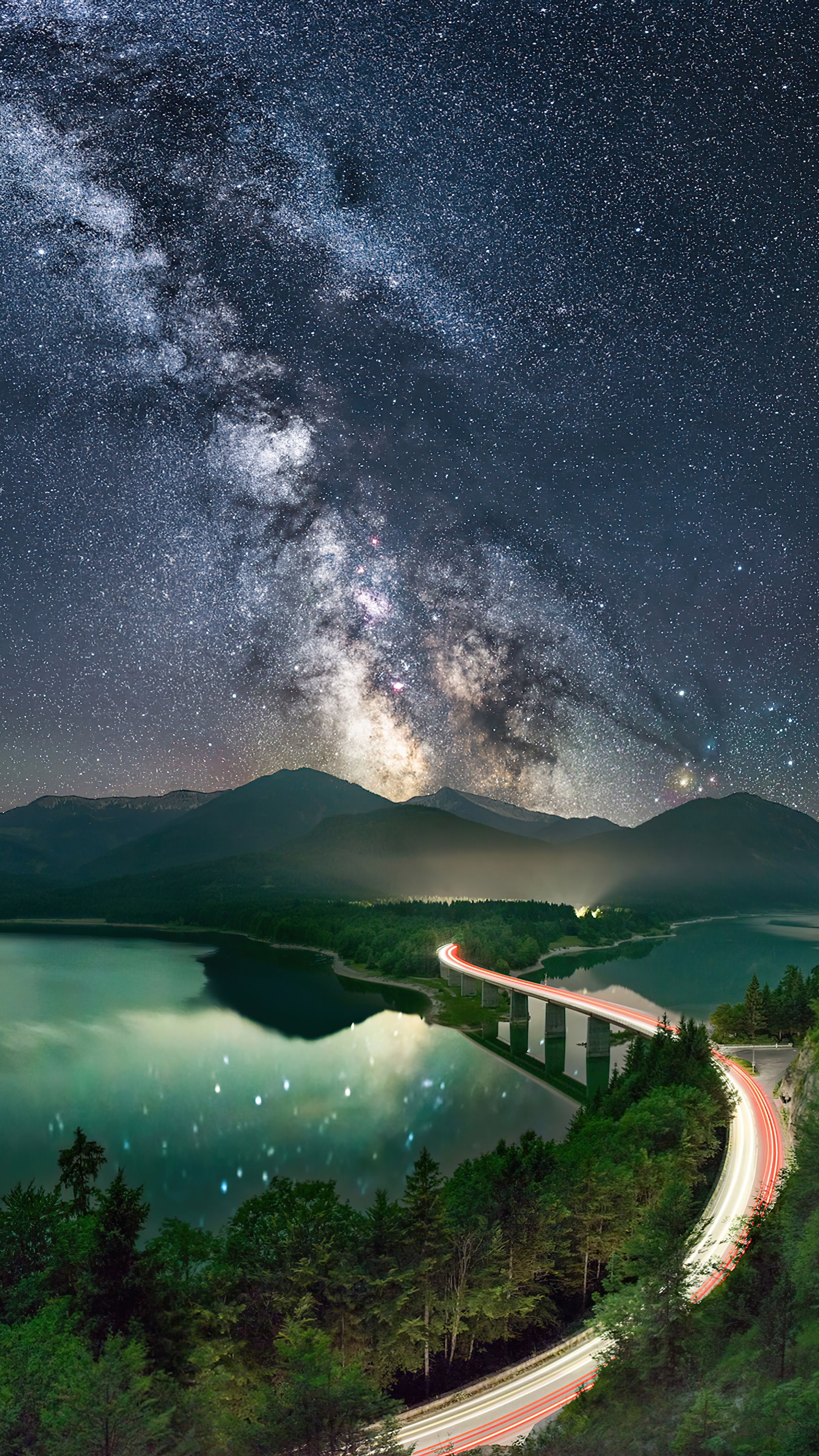 Milky Way over a lake and bridge with light trails HD Phone Wallpaper