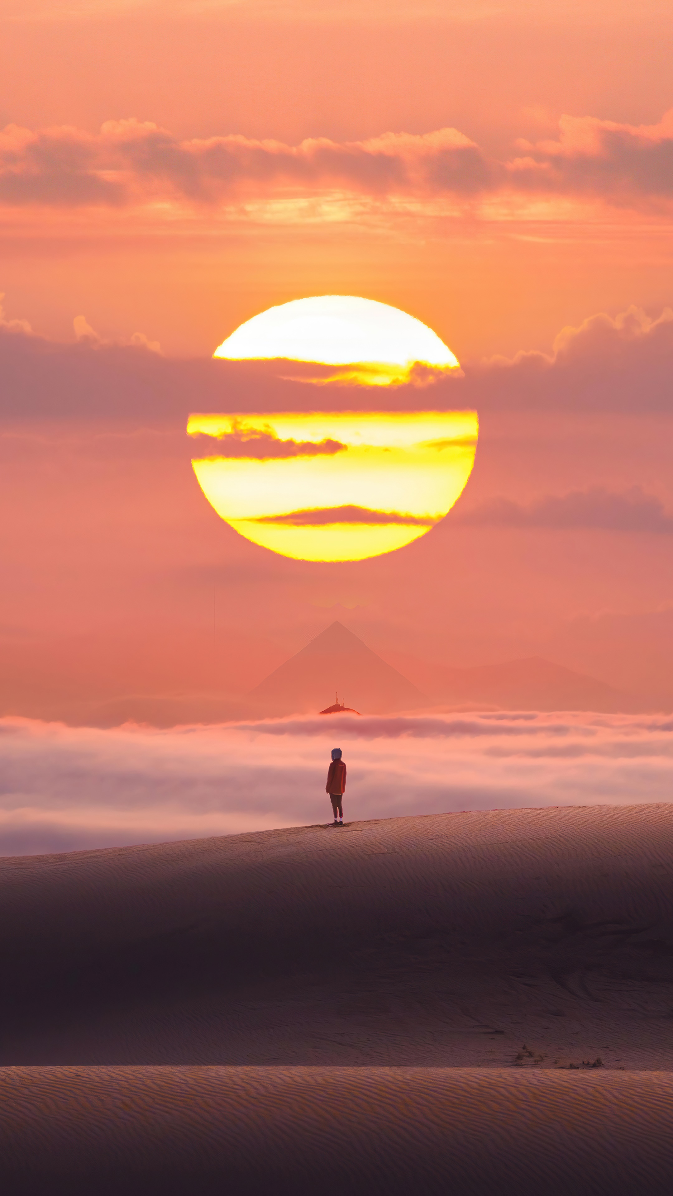 Person standing on sand dune at sunset with pyramid HD Phone Wallpaper