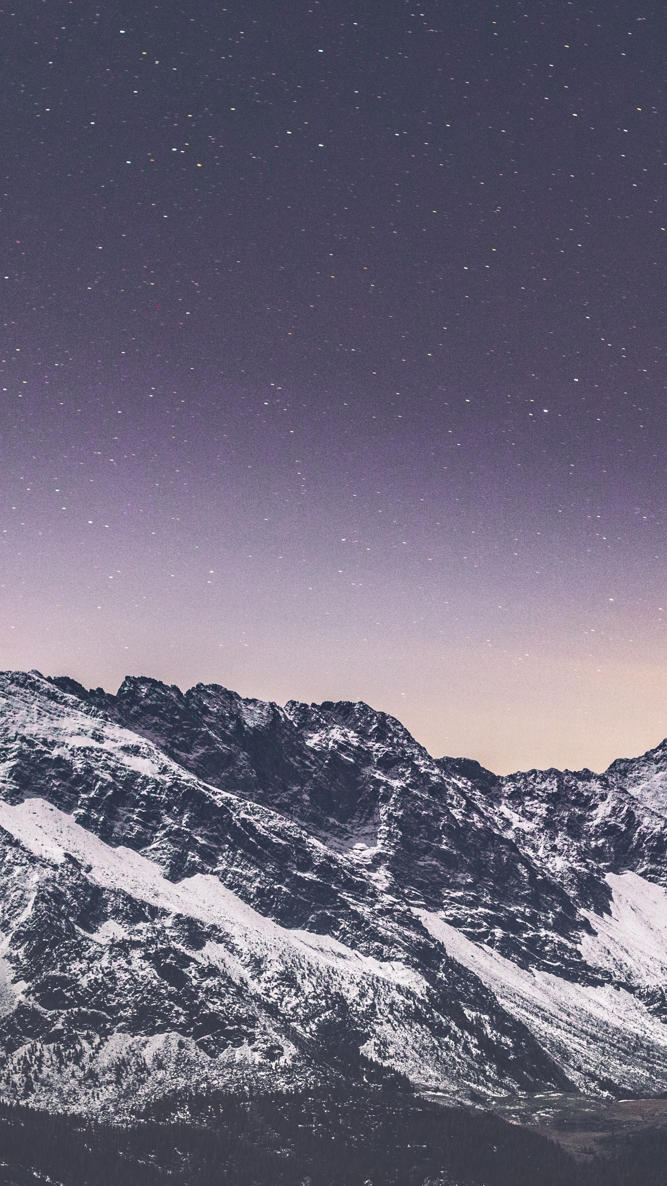 Snowy mountains under a starry night sky 4K HD Phone Wallpaper