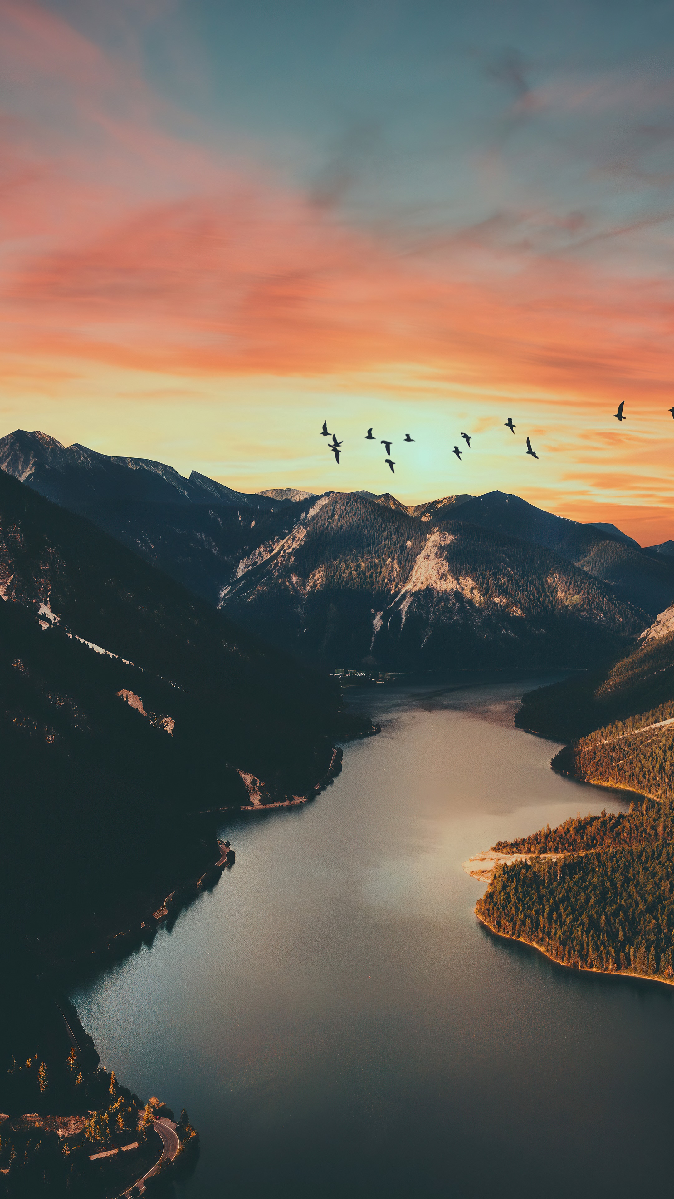 Birds flying over mountains and lake at sunset 4K HD Phone Wallpaper