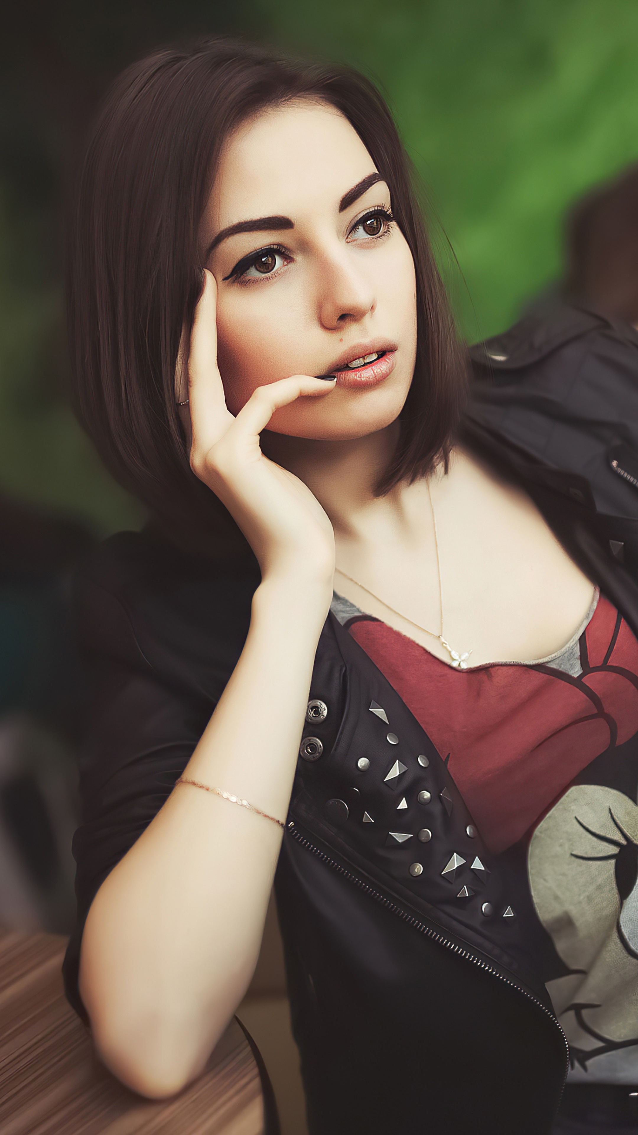 Young woman with short brown hair wearing a black jacket HD Phone Wallpaper