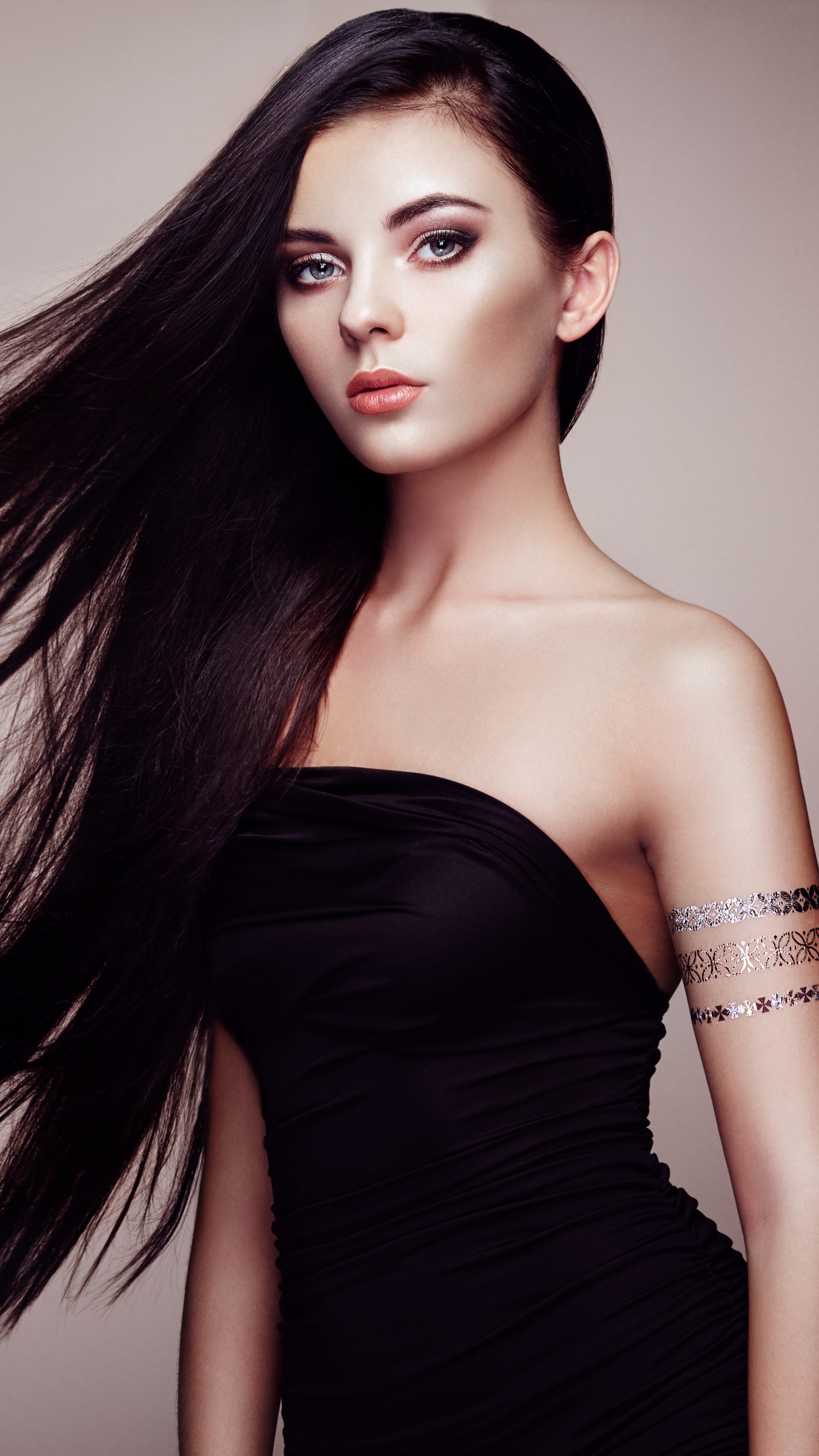 Model in black dress with arm tattoos HD Phone Wallpaper