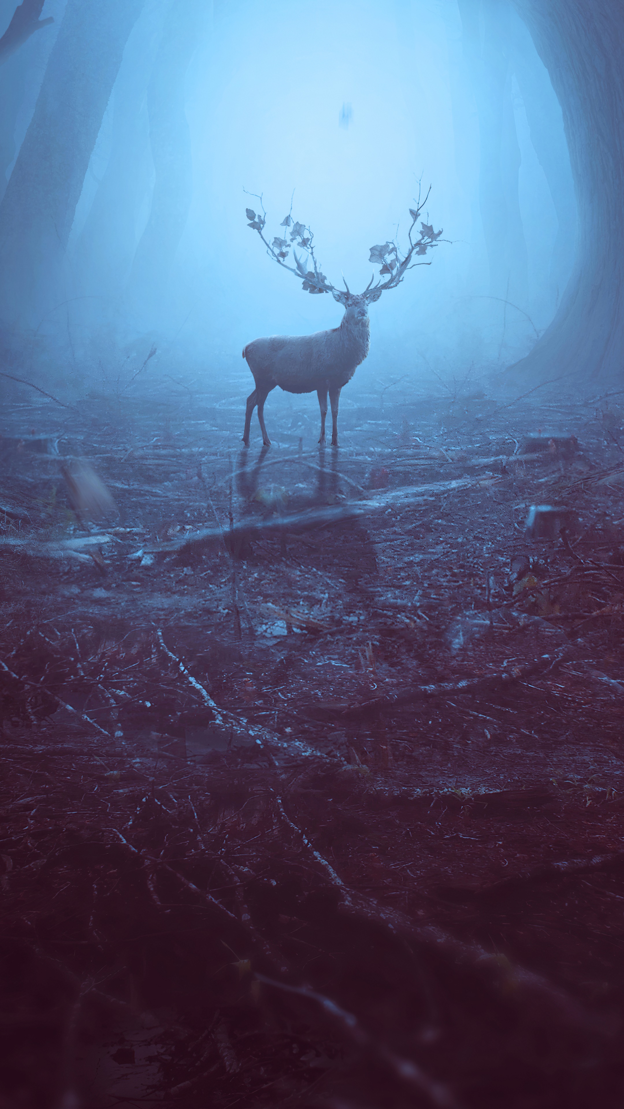 Reindeer with leafy antlers in a foggy forest HD Phone Wallpaper