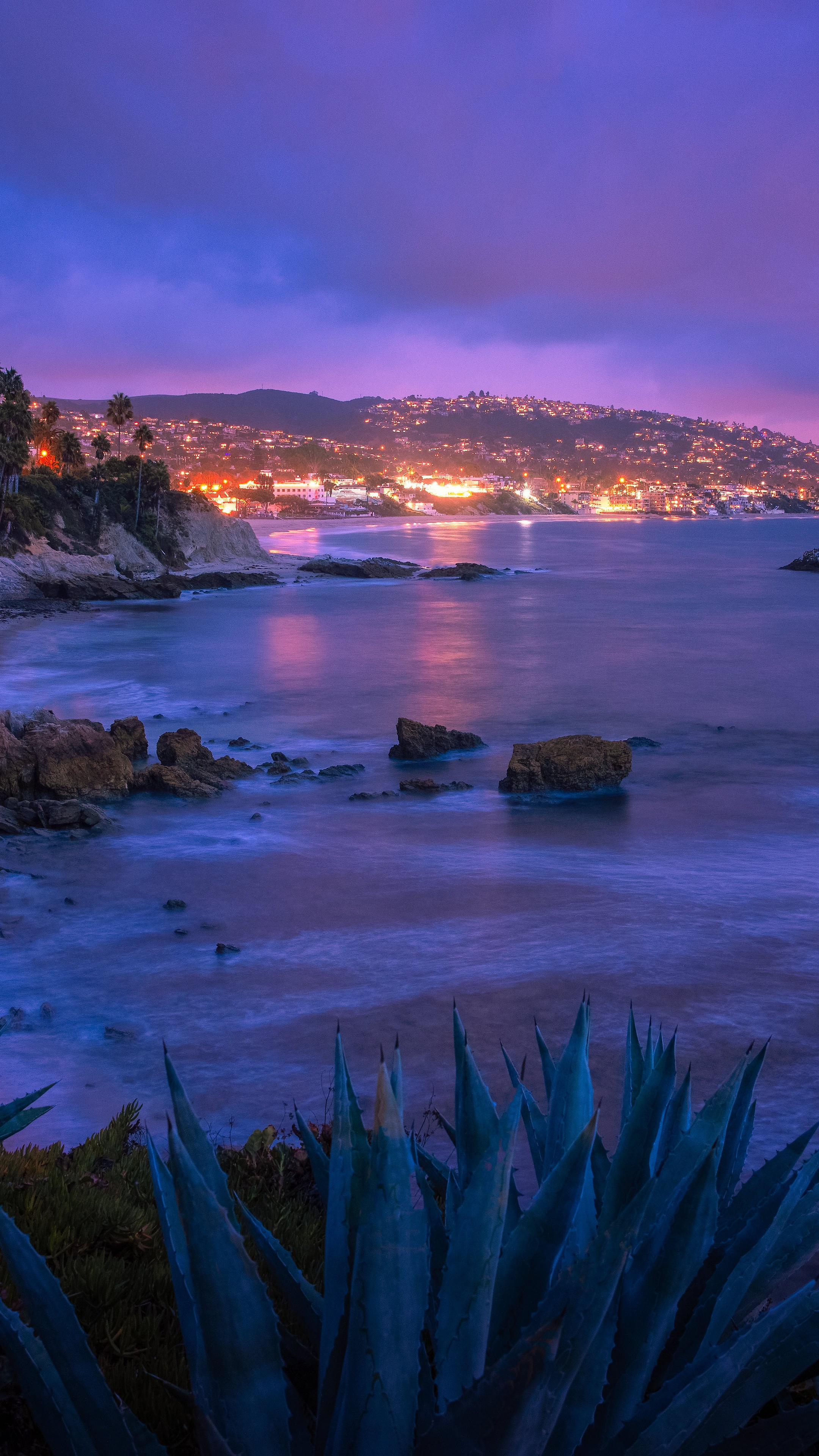 Ocean view with city lights at dusk HD Phone Wallpaper
