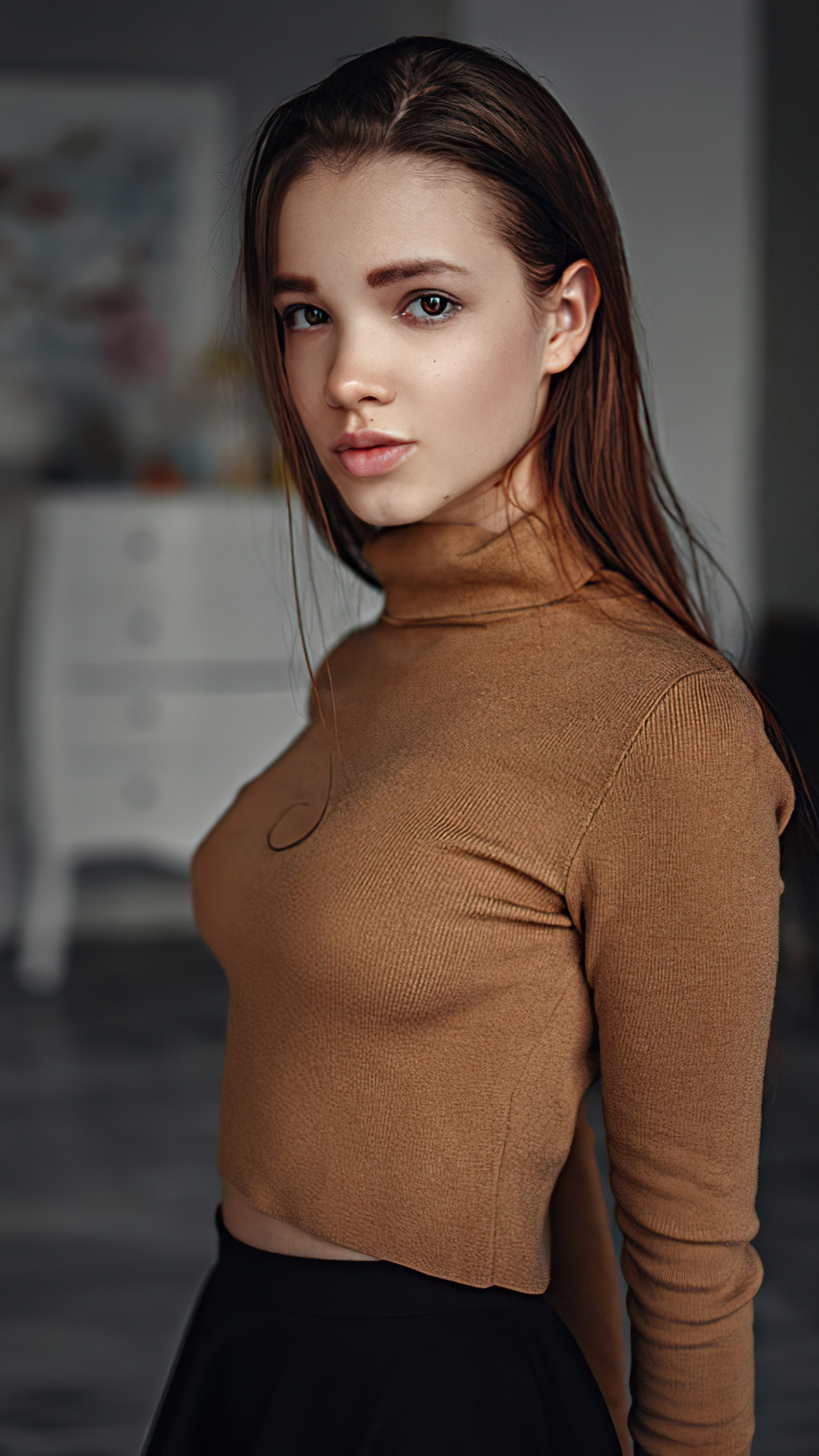 Young woman in a brown turtleneck and black skirt HD Phone Wallpaper