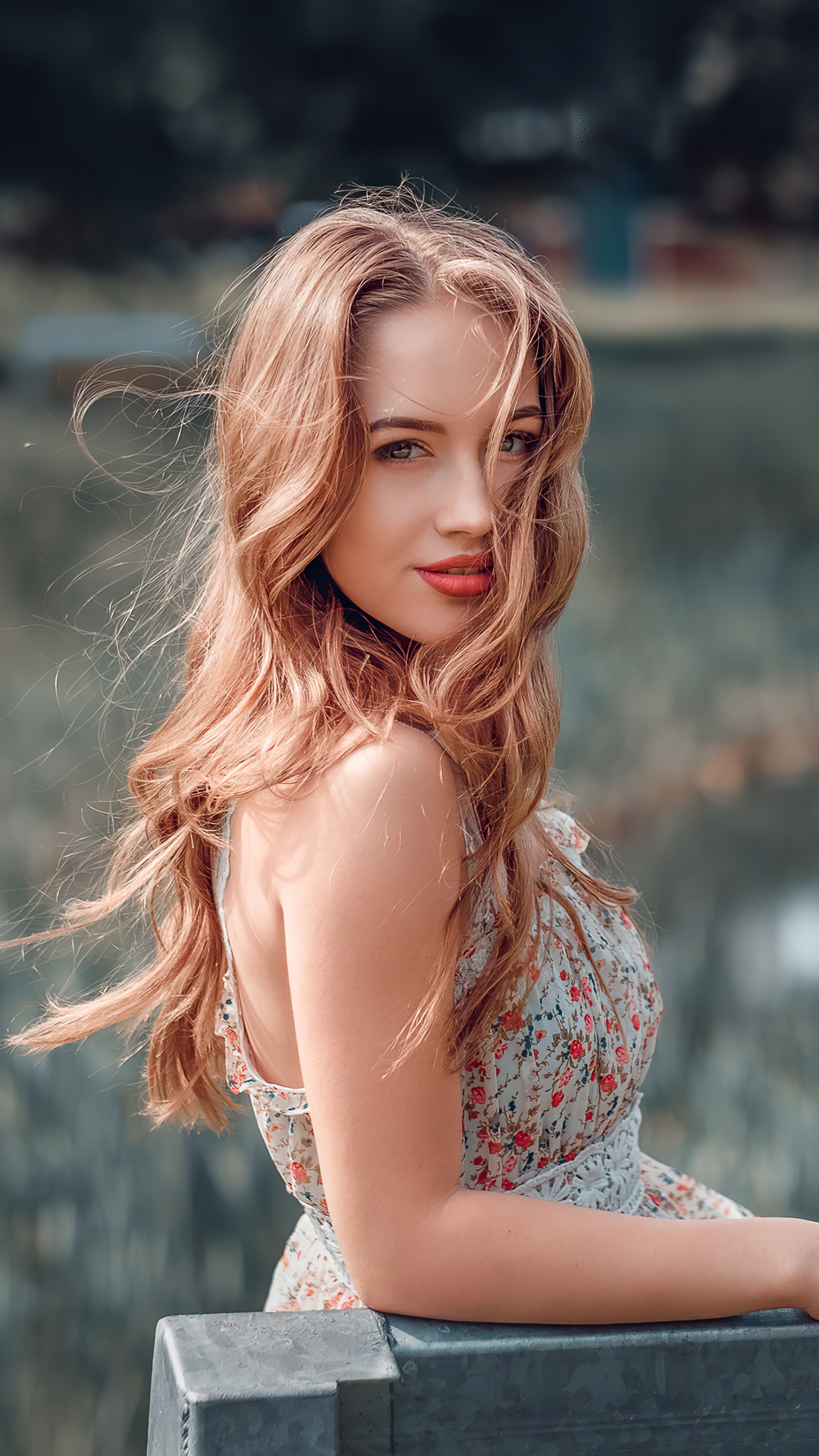 Woman with long wavy hair in a floral dress HD Phone Wallpaper