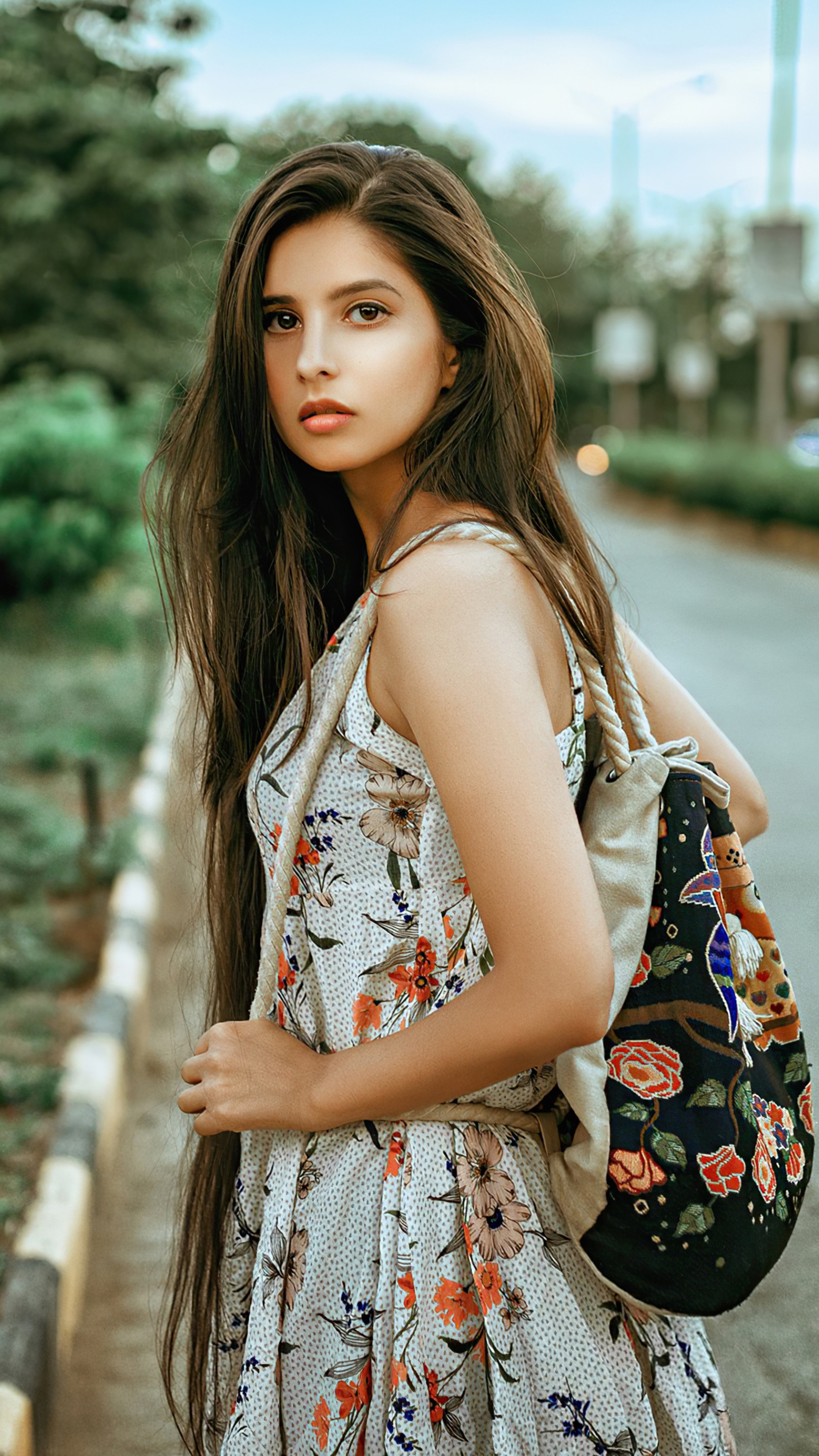Girl with floral dress and backpack HD Phone Wallpaper