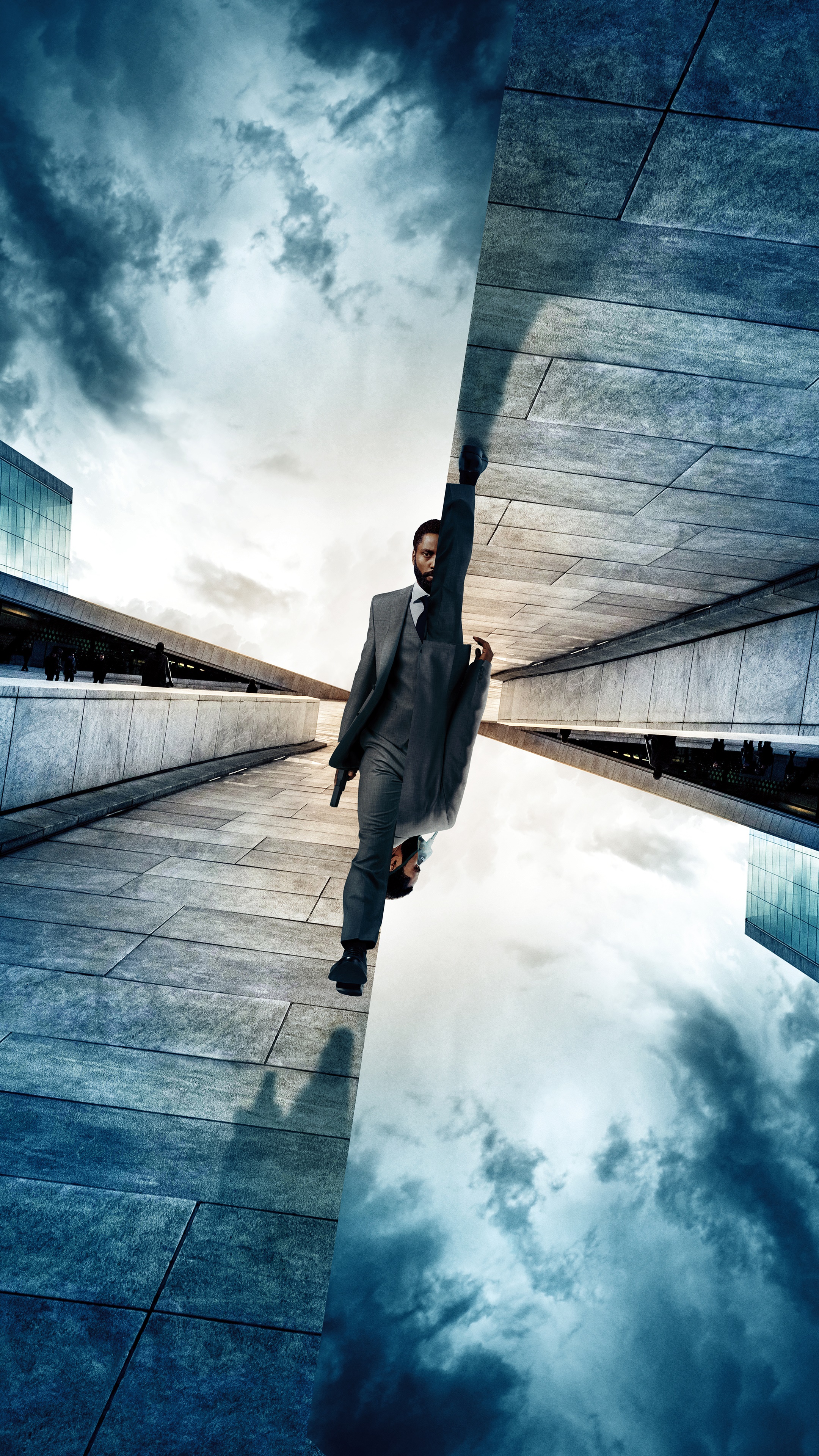 Man in suit holding a gun in Tenet HD Phone Wallpaper