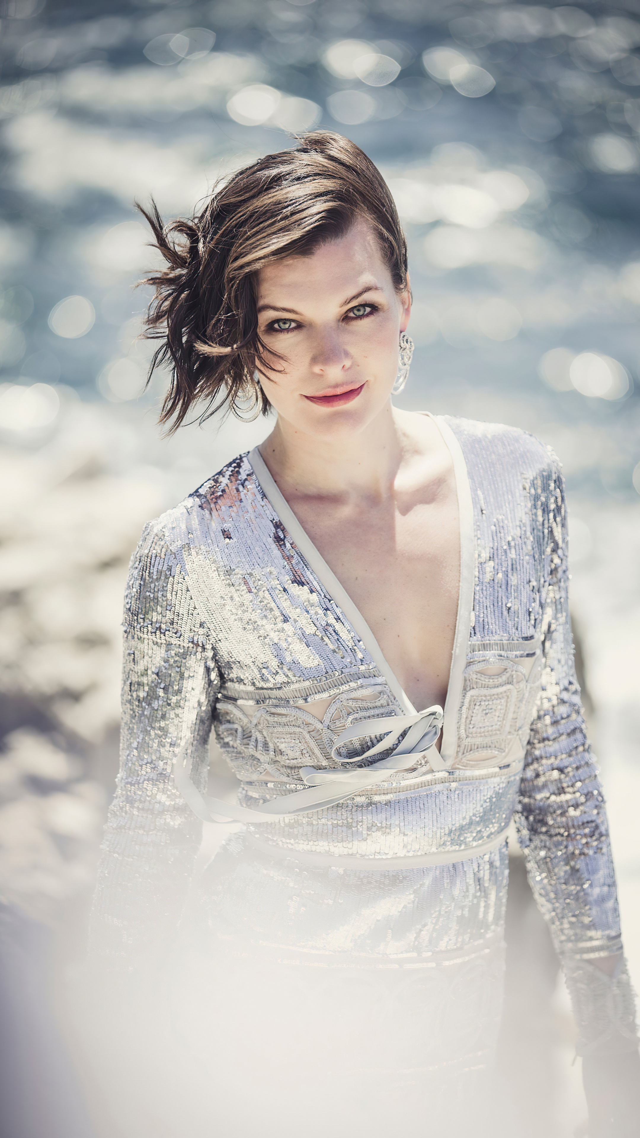 Milla Jovovich posing by the water HD Phone Wallpaper