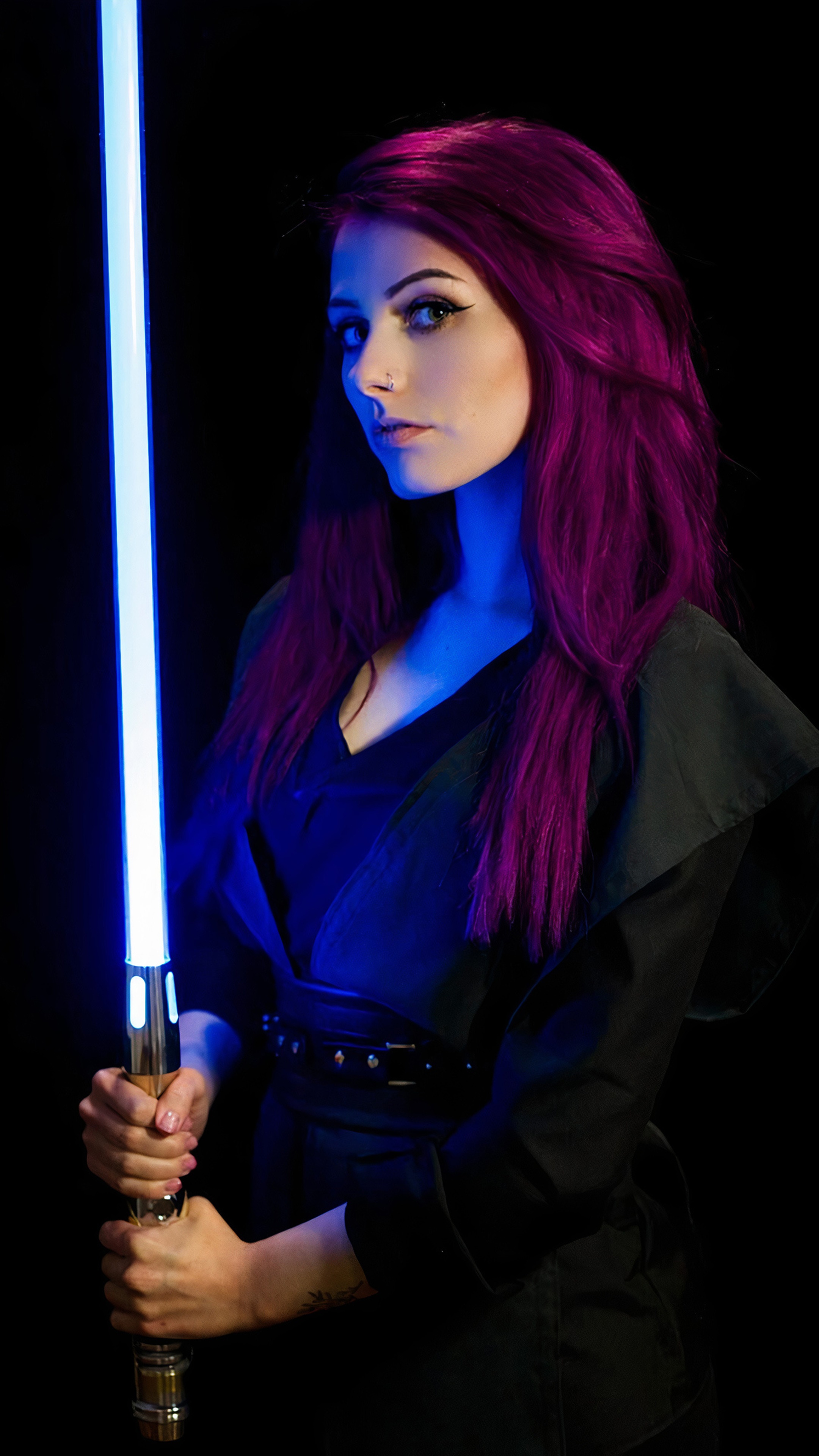 Woman in Star Wars cosplay holding a lightsaber HD Phone Wallpaper