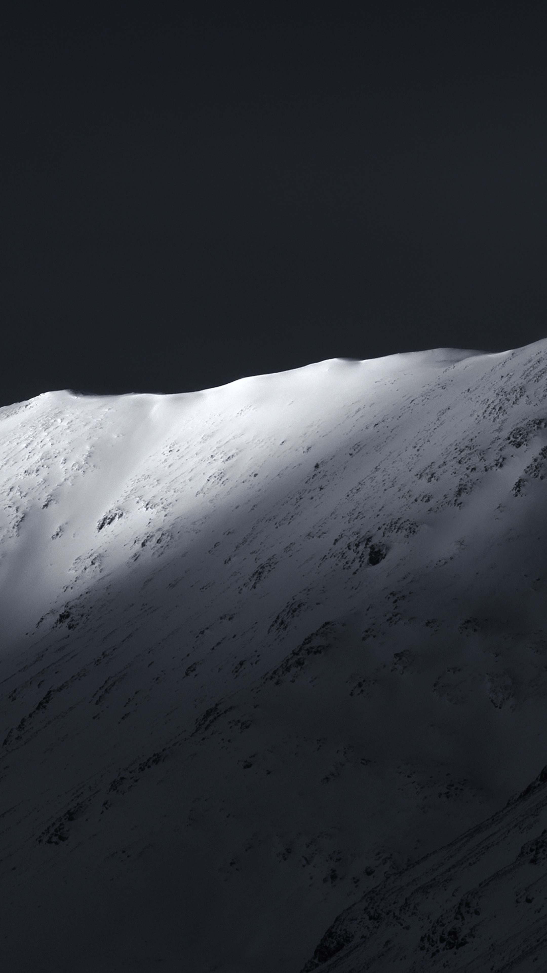 Snowy mountain ridge in dramatic light 4K HD Phone Wallpaper