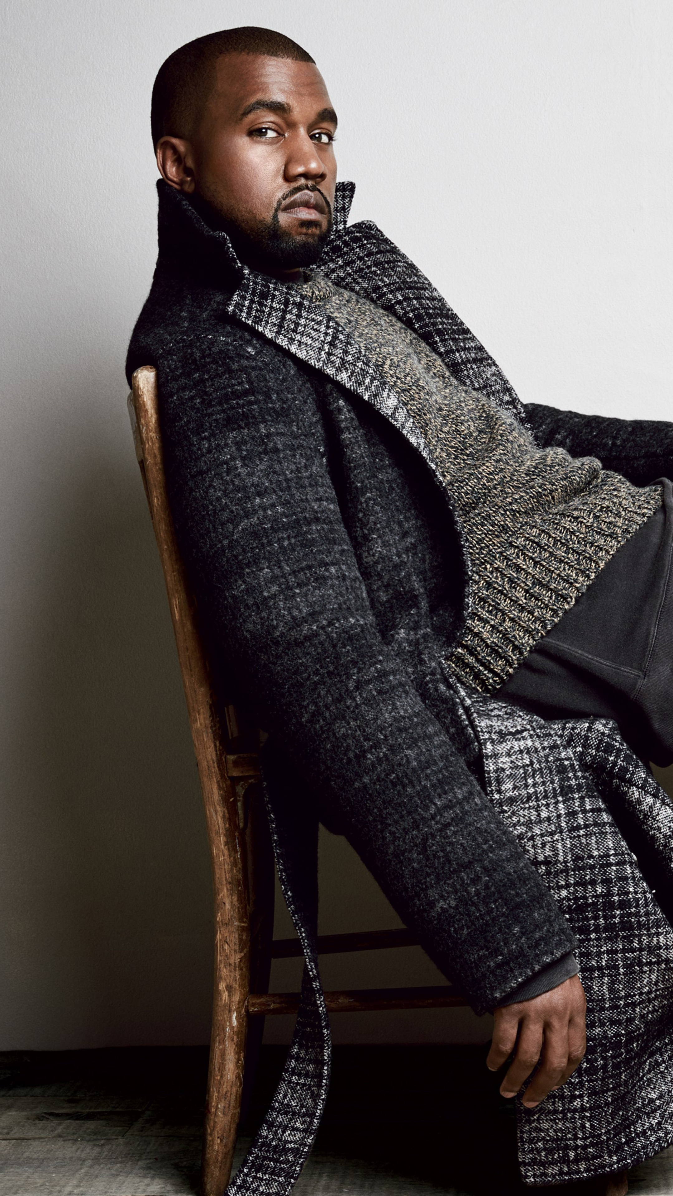 Kanye West wearing a coat and sweater HD Phone Wallpaper