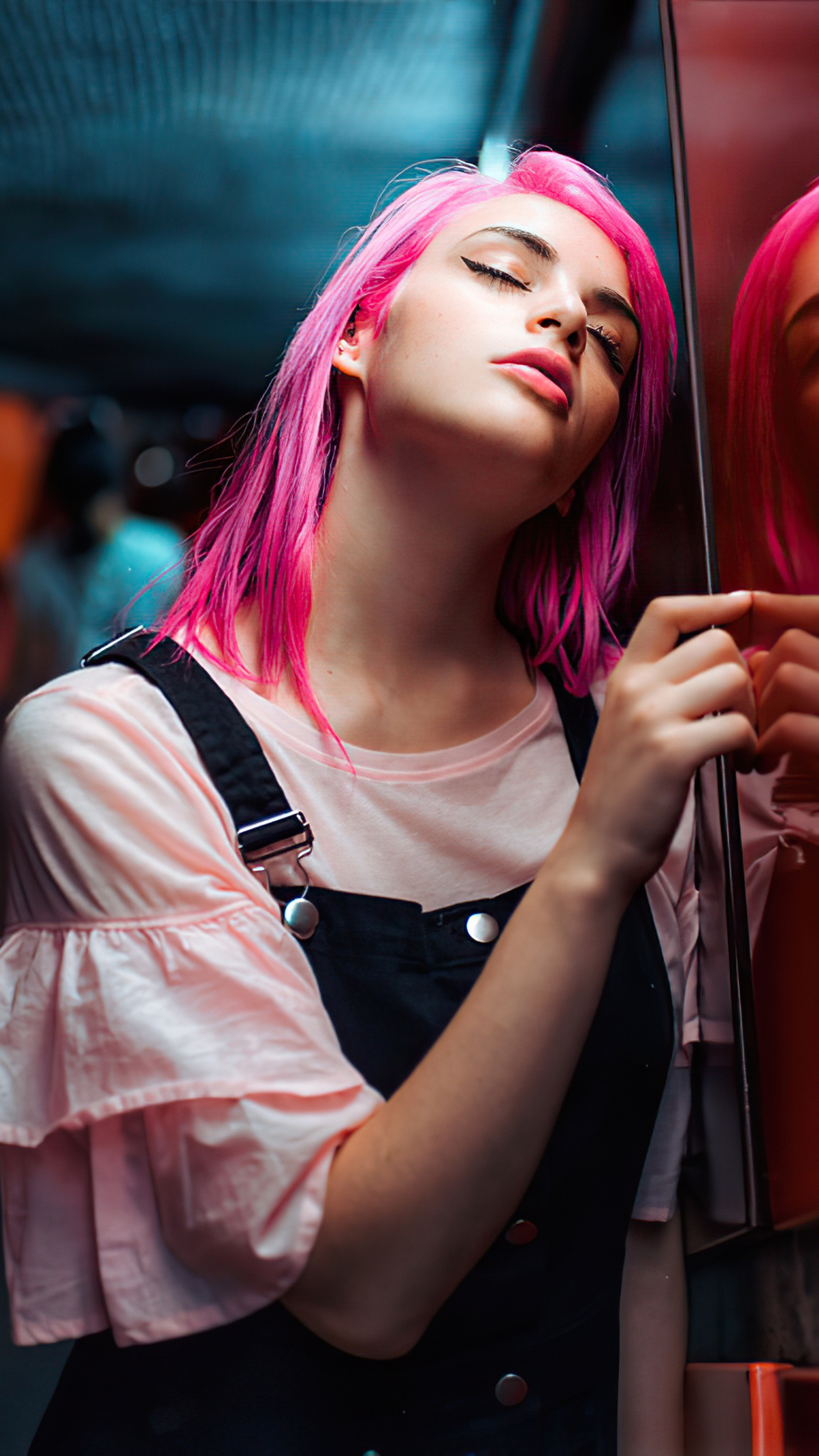 Model with pink hair wearing overalls and pink shirt HD Phone Wallpaper