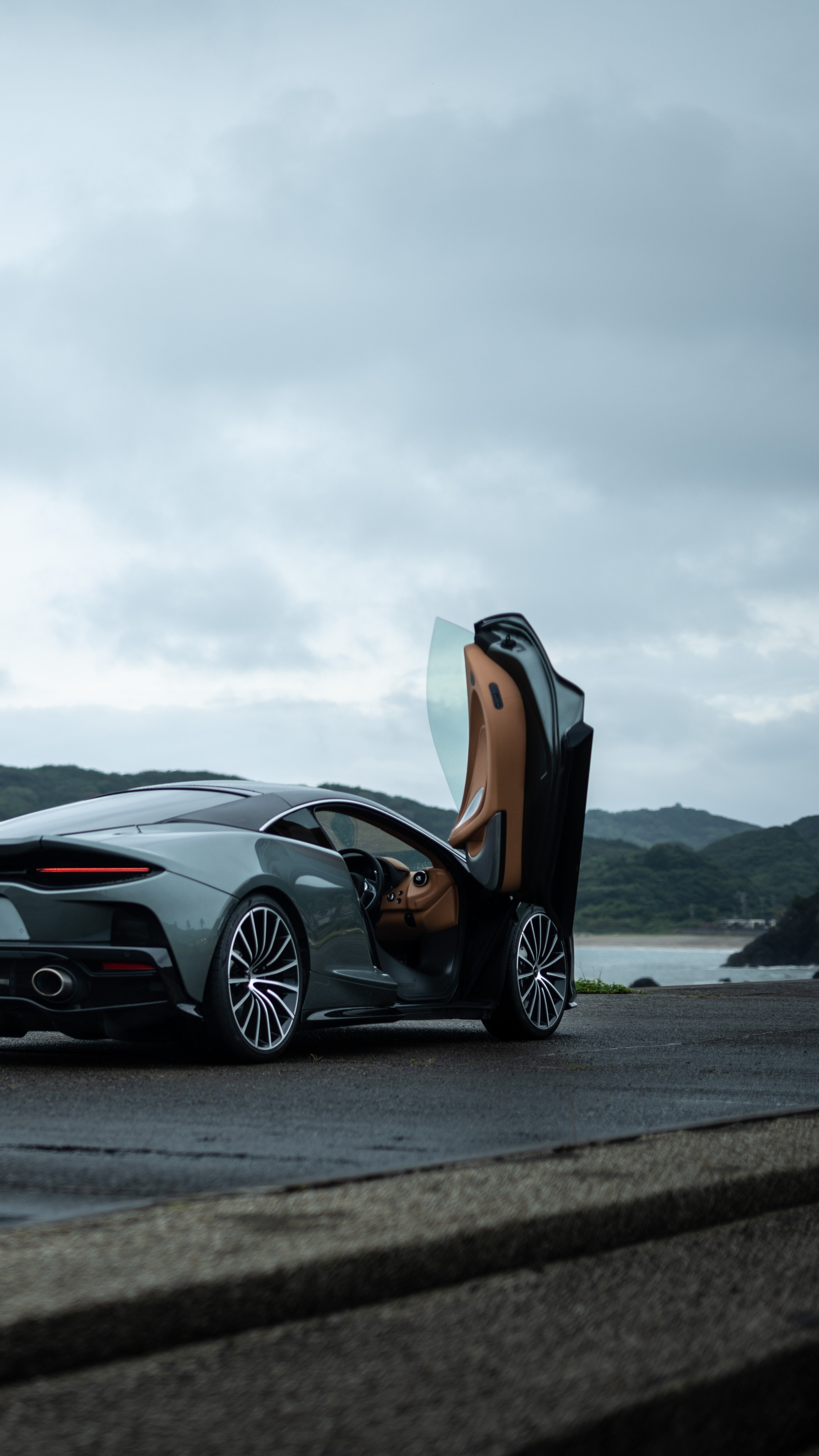 McLaren car with doors open by the sea HD Phone Wallpaper
