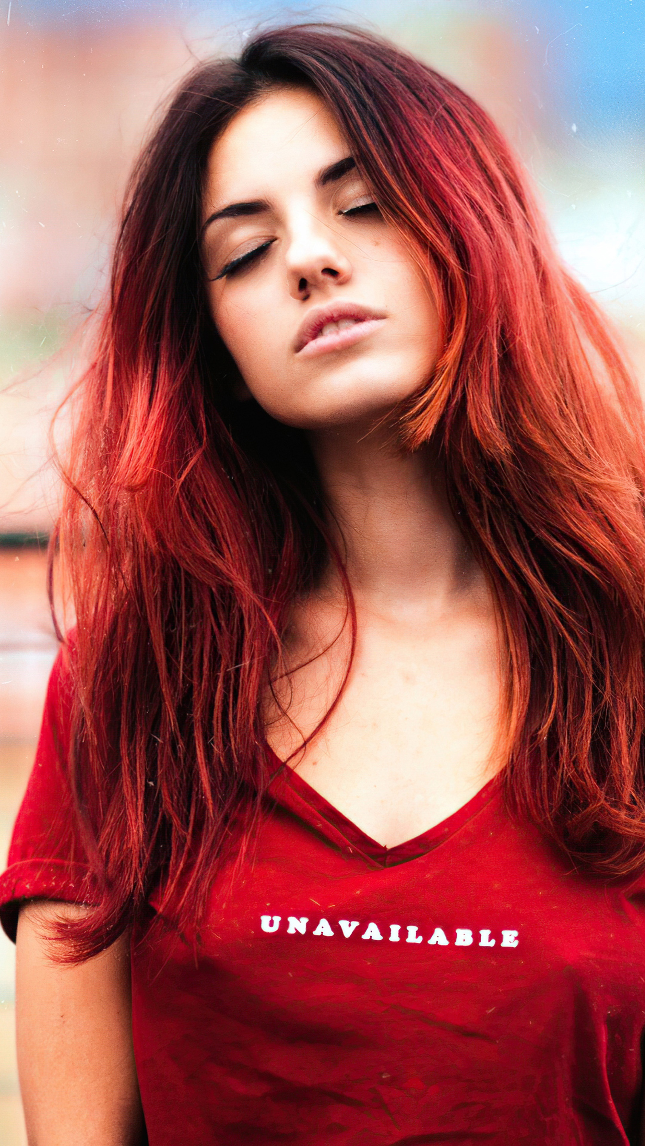 Woman with red hair wearing a red t-shirt with 'UNAVAILABLE' text HD Phone Wallpaper