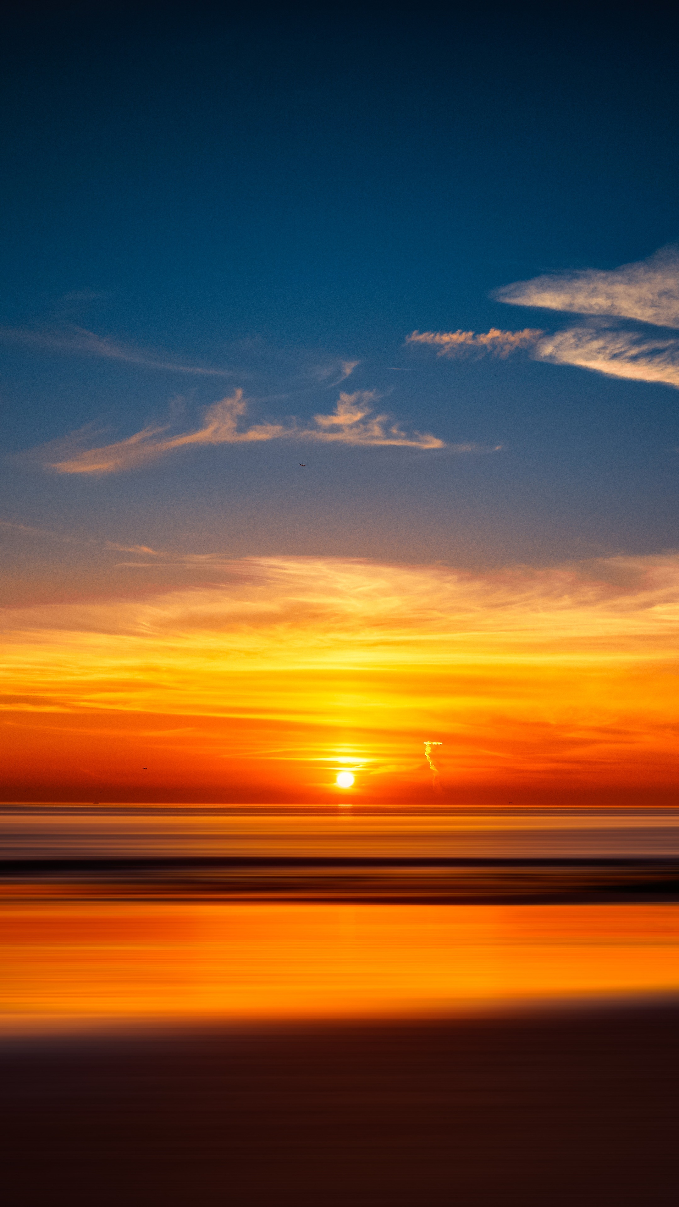 Sunset over the ocean with colorful sky HD Phone Wallpaper