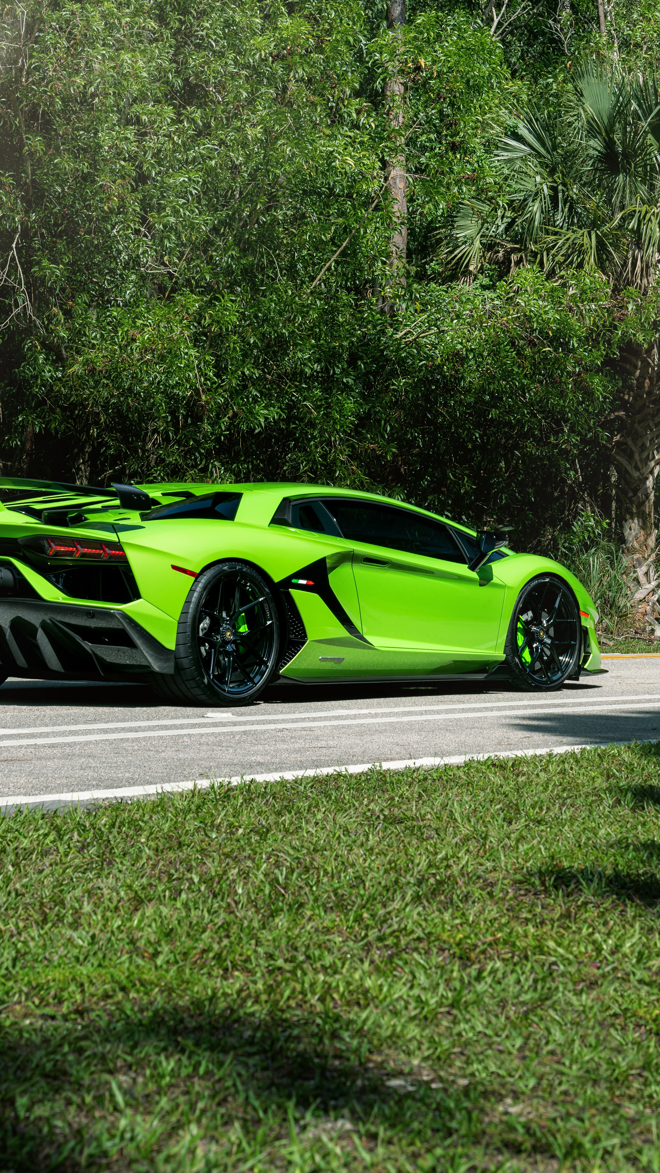Green Lamborghini Aventador parked on a road HD Phone Wallpaper