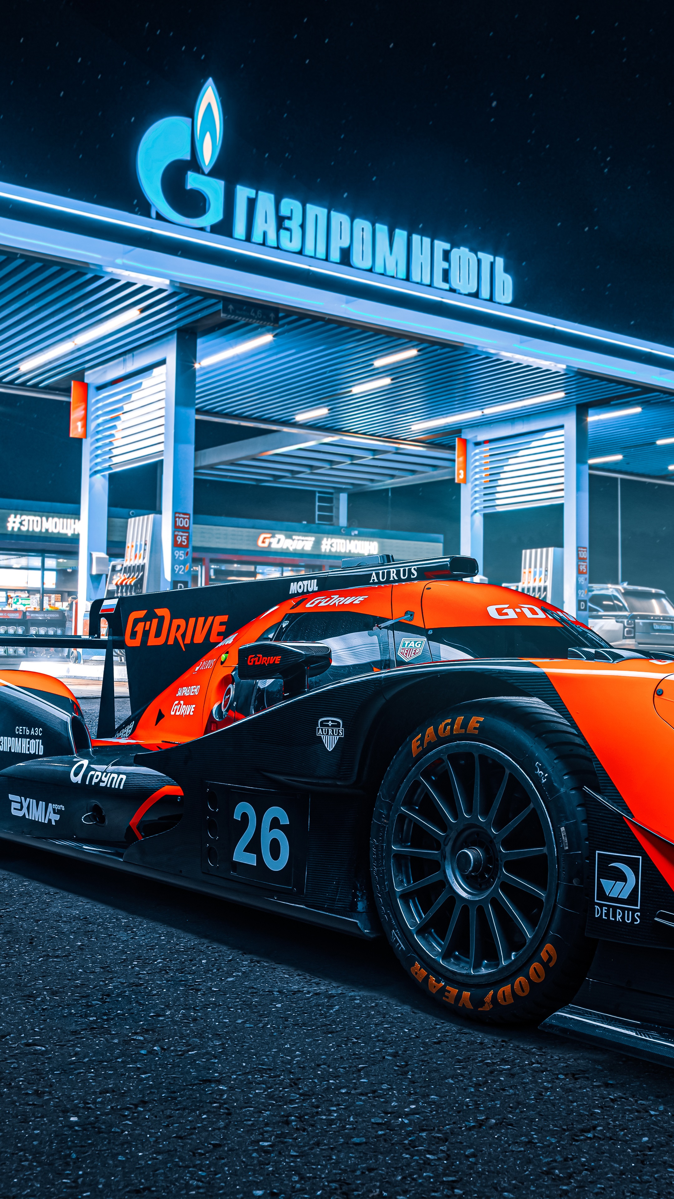 Gazprom Neft racing car at a gas station HD Phone Wallpaper