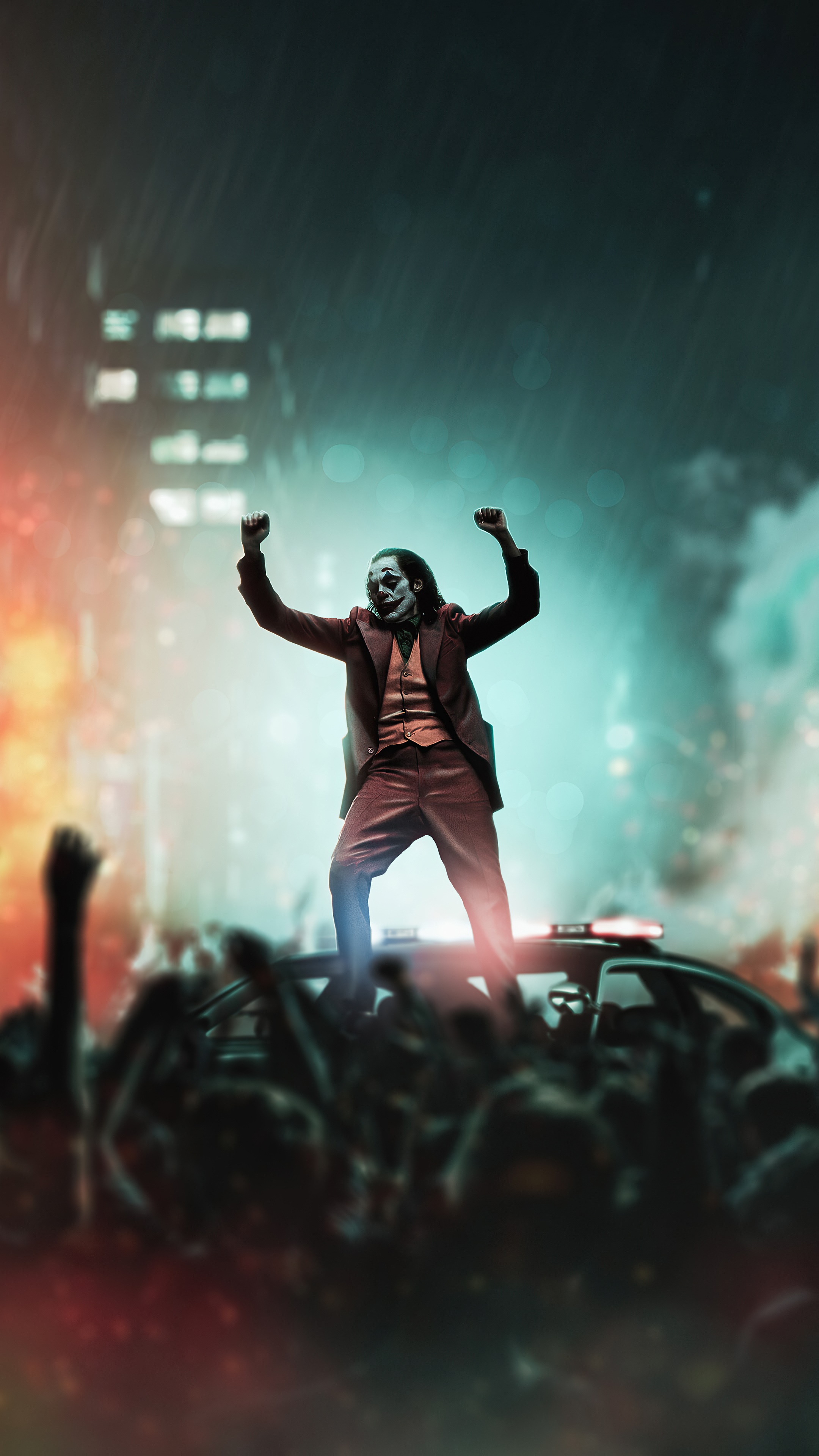 Joker standing on a police car in a crowd HD Phone Wallpaper