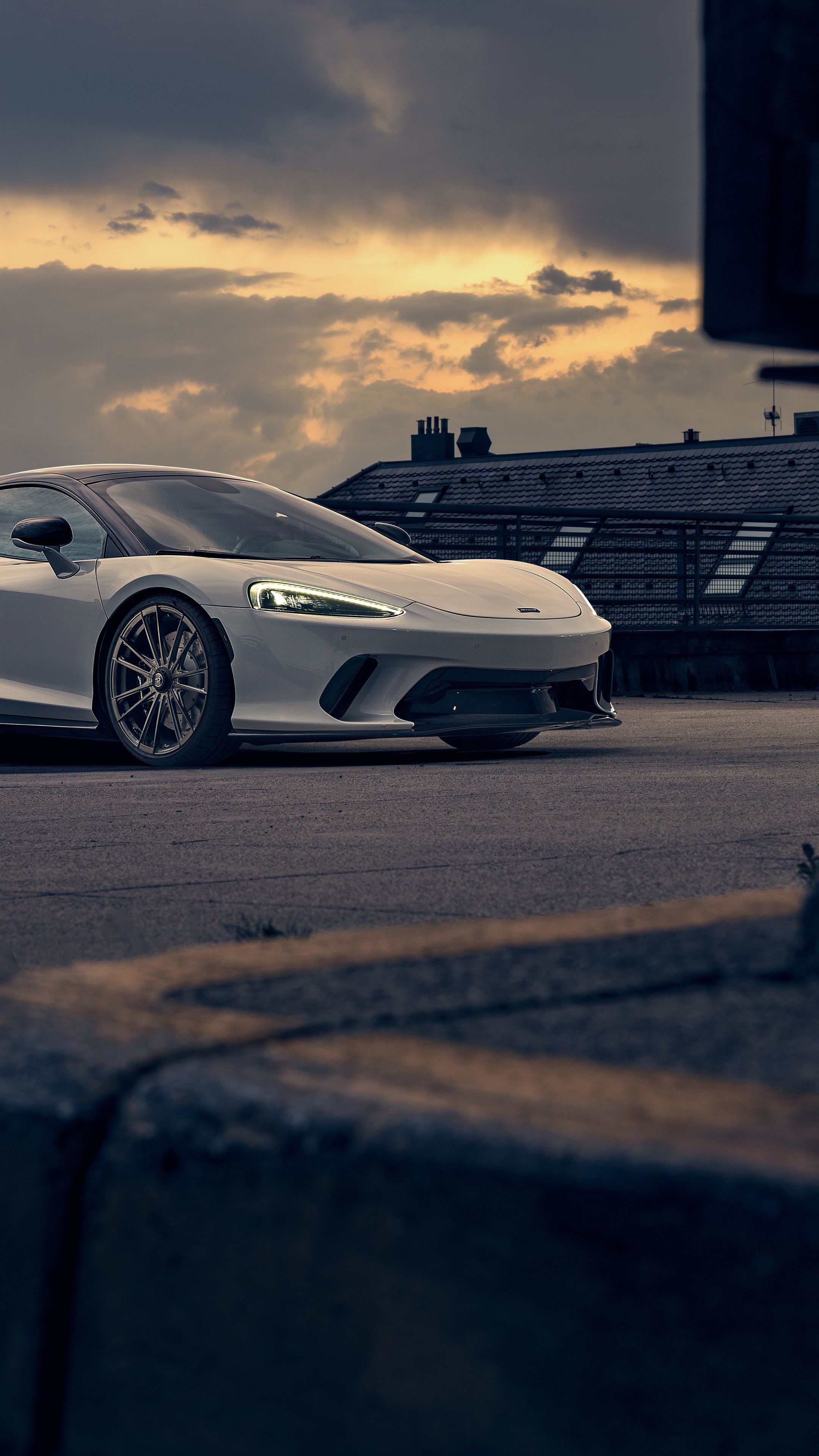 White McLaren GT parked on asphalt HD Phone Wallpaper