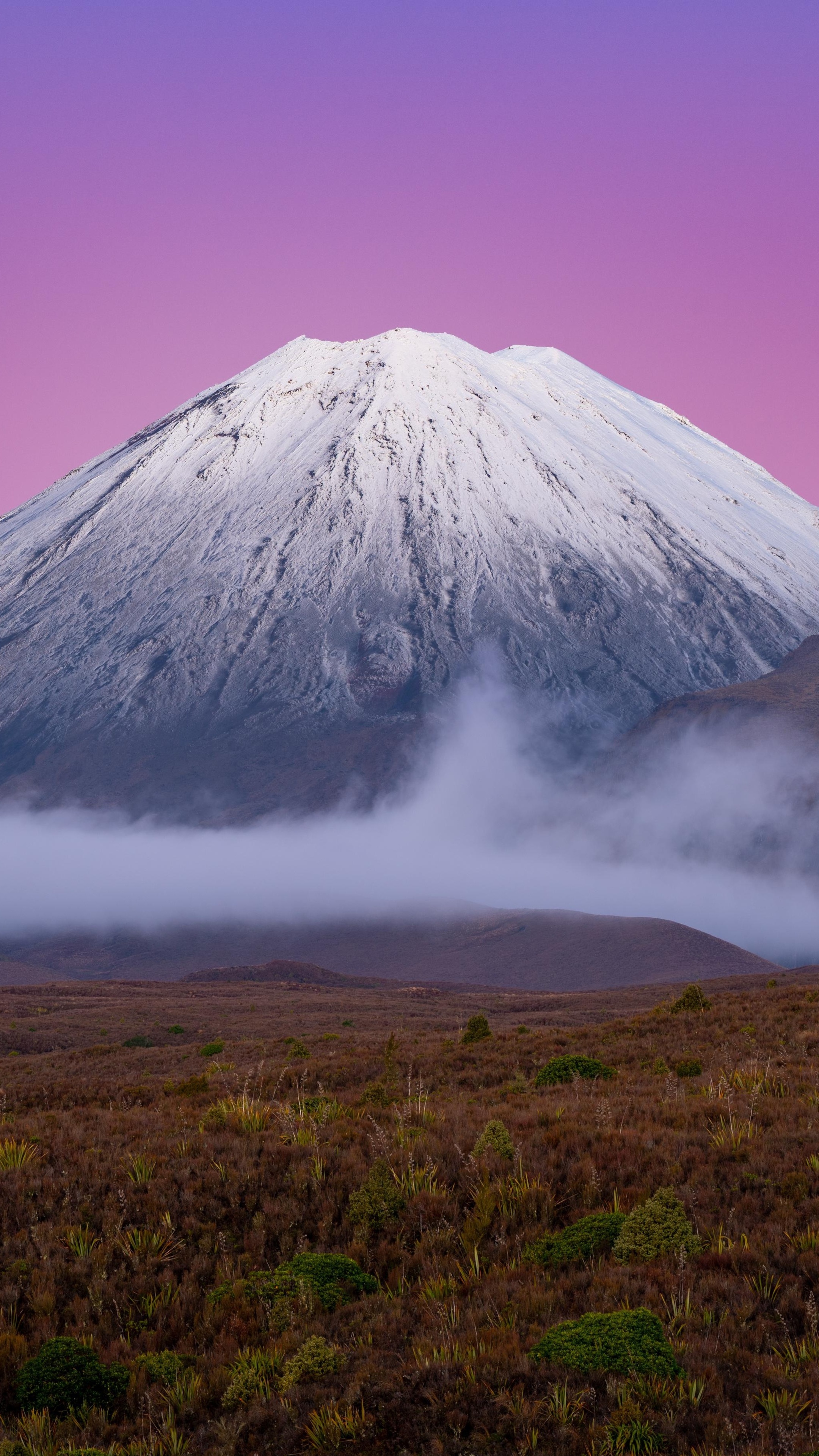 Snow-capped mountain under a purple sky HD Phone Wallpaper