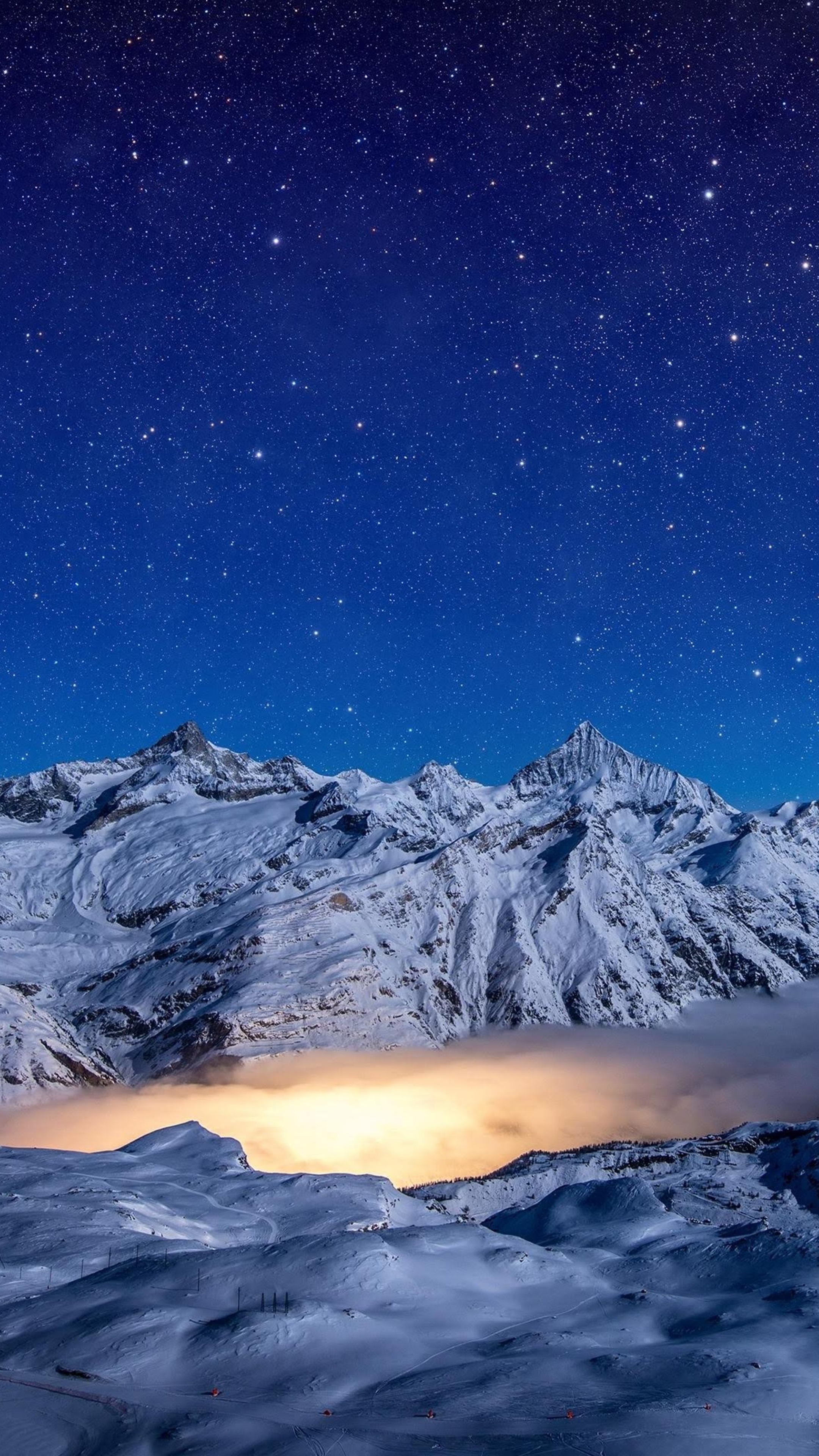 Snowy mountains under a starry night sky HD Phone Wallpaper