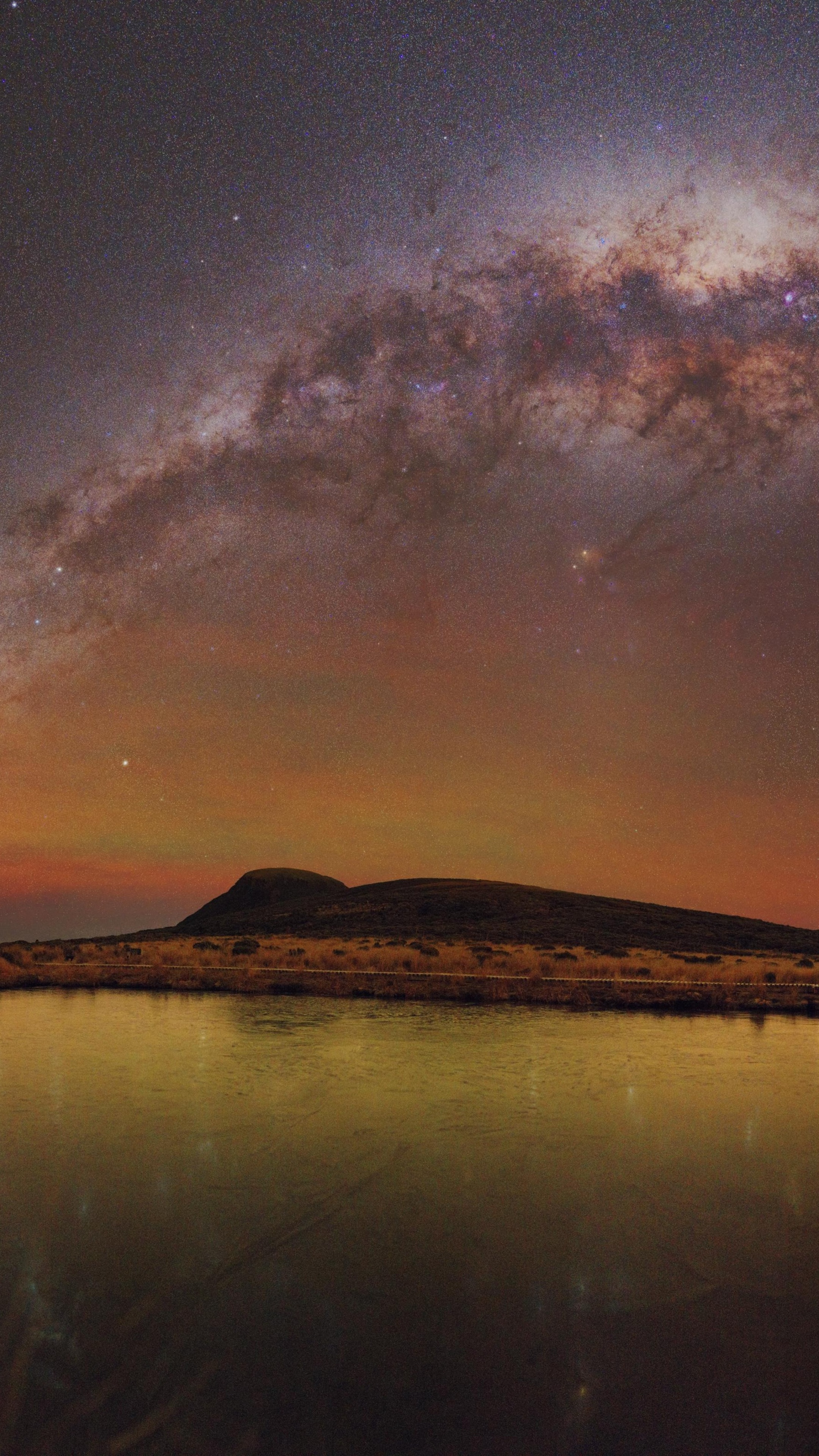 Milky Way over a lake and hill HD Phone Wallpaper