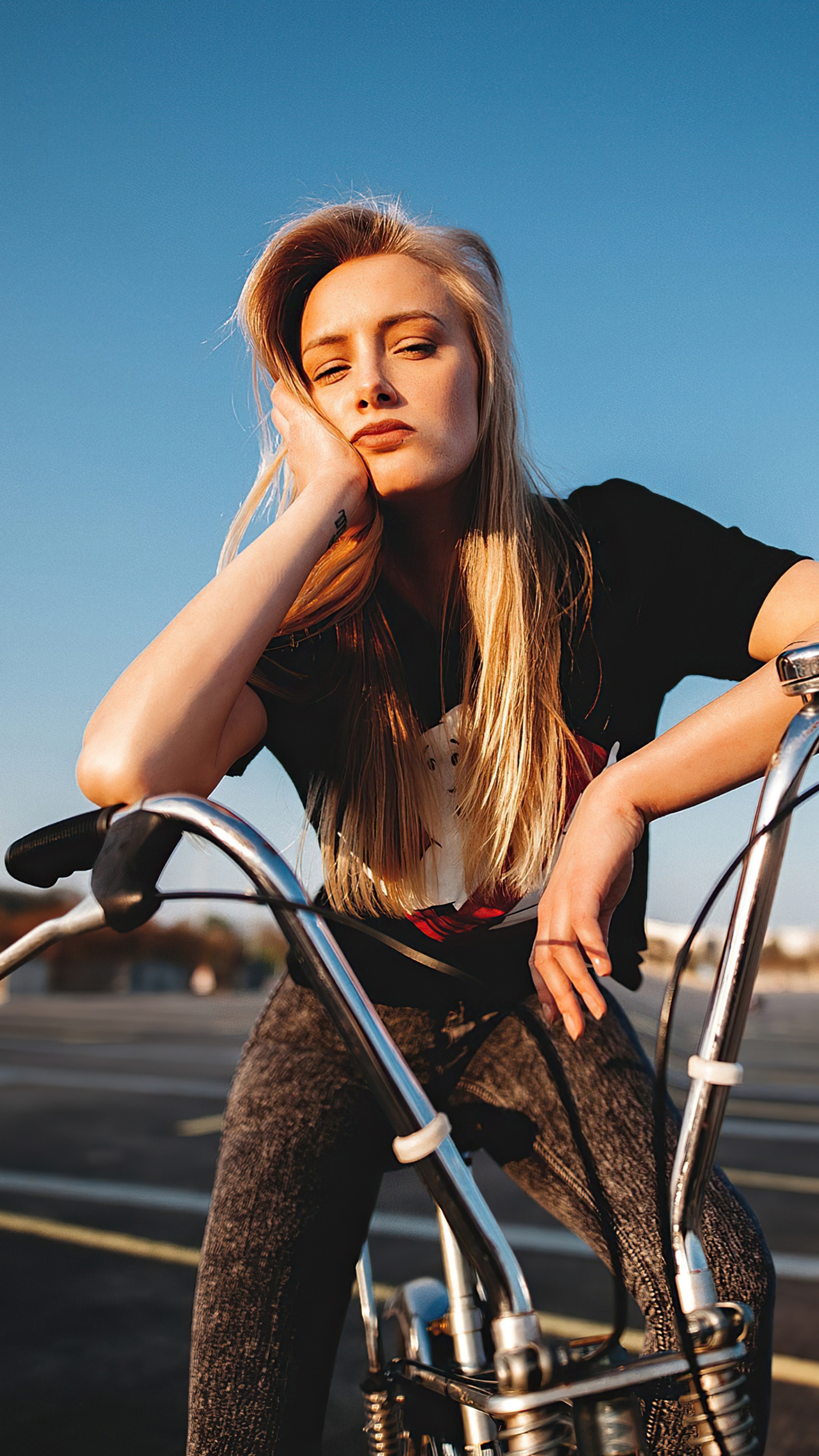 Woman with blonde hair on a bicycle HD Phone Wallpaper