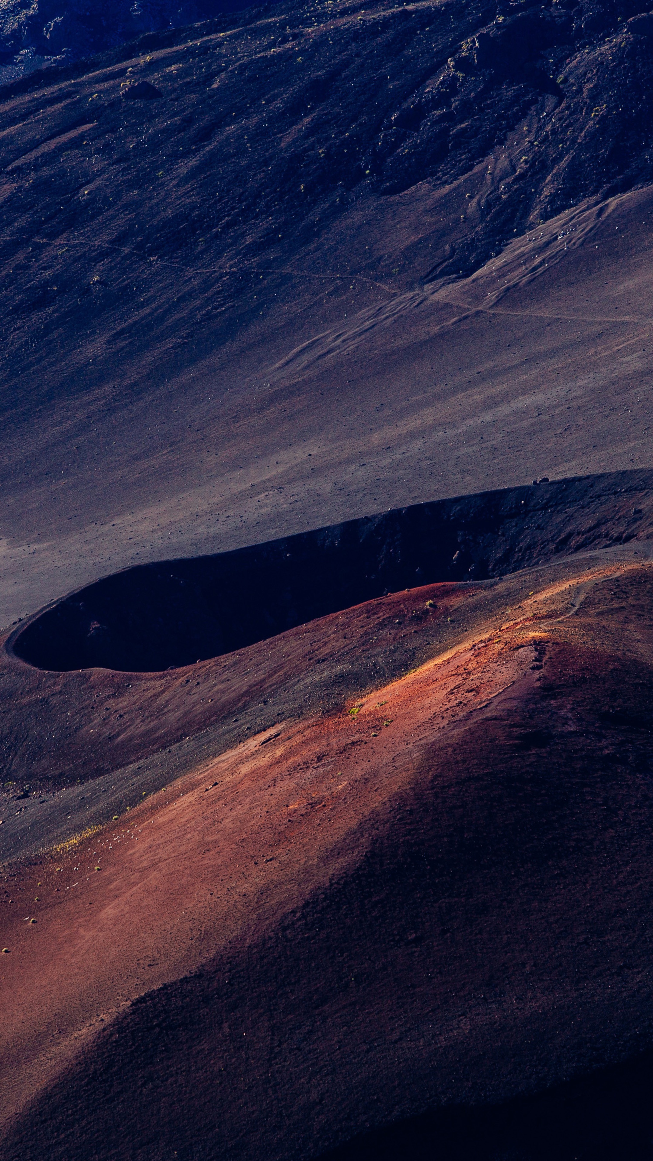 Volcanic crater landscape with red and dark soil HD Phone Wallpaper