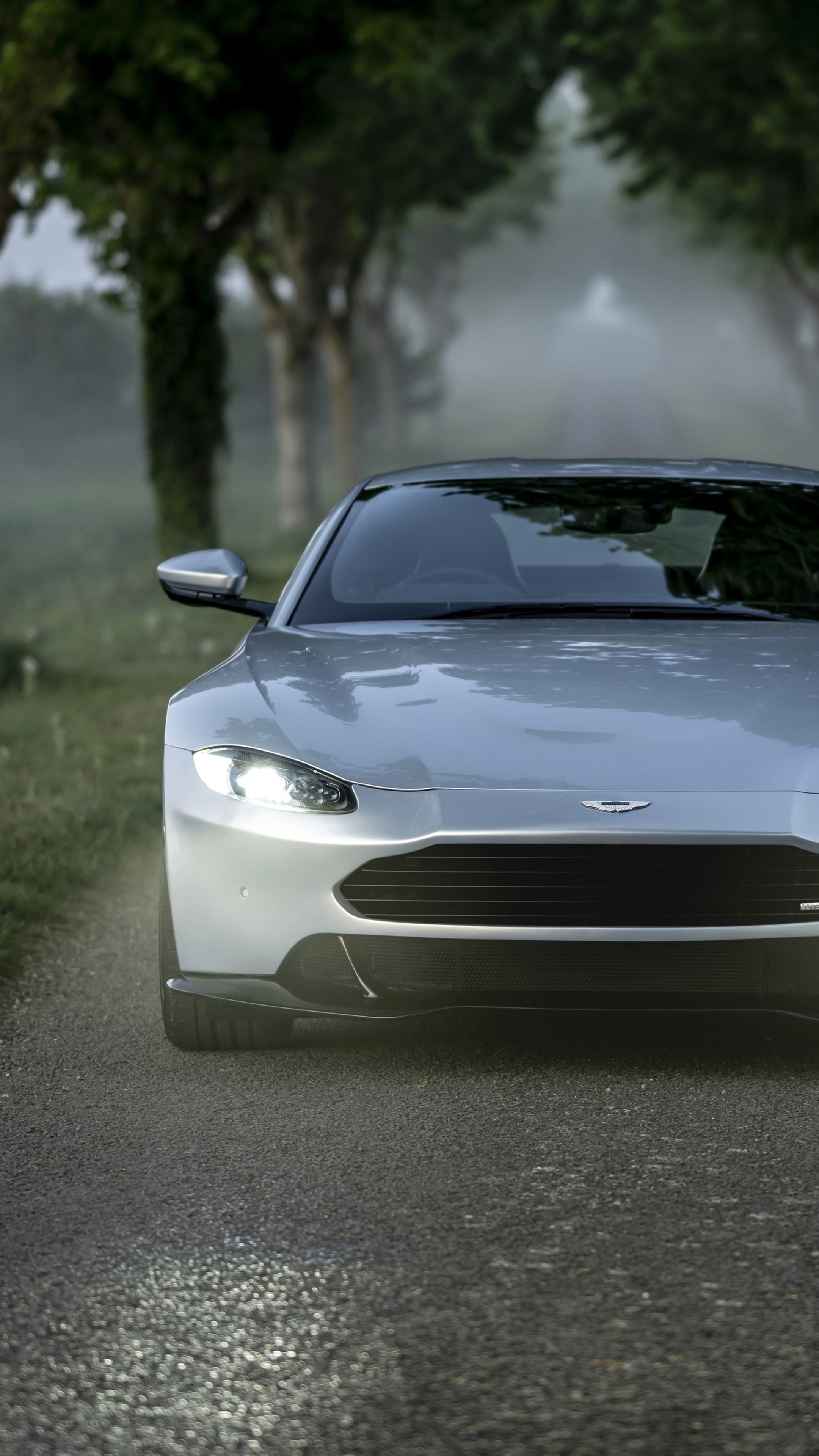 Aston Martin Vantage on a foggy road HD Phone Wallpaper