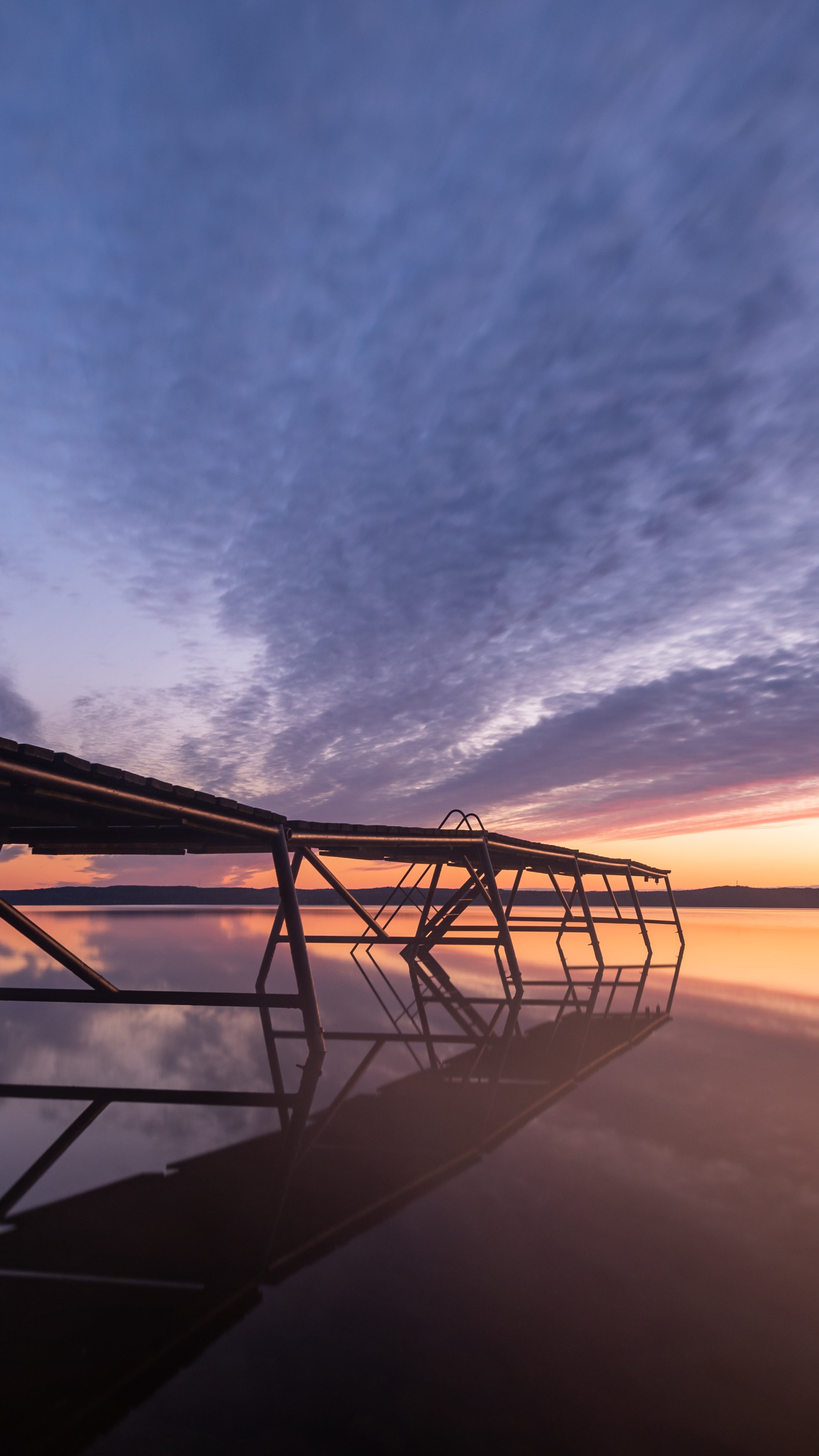 Wooden dock on a lake at sunset with colorful clouds HD Phone Wallpaper