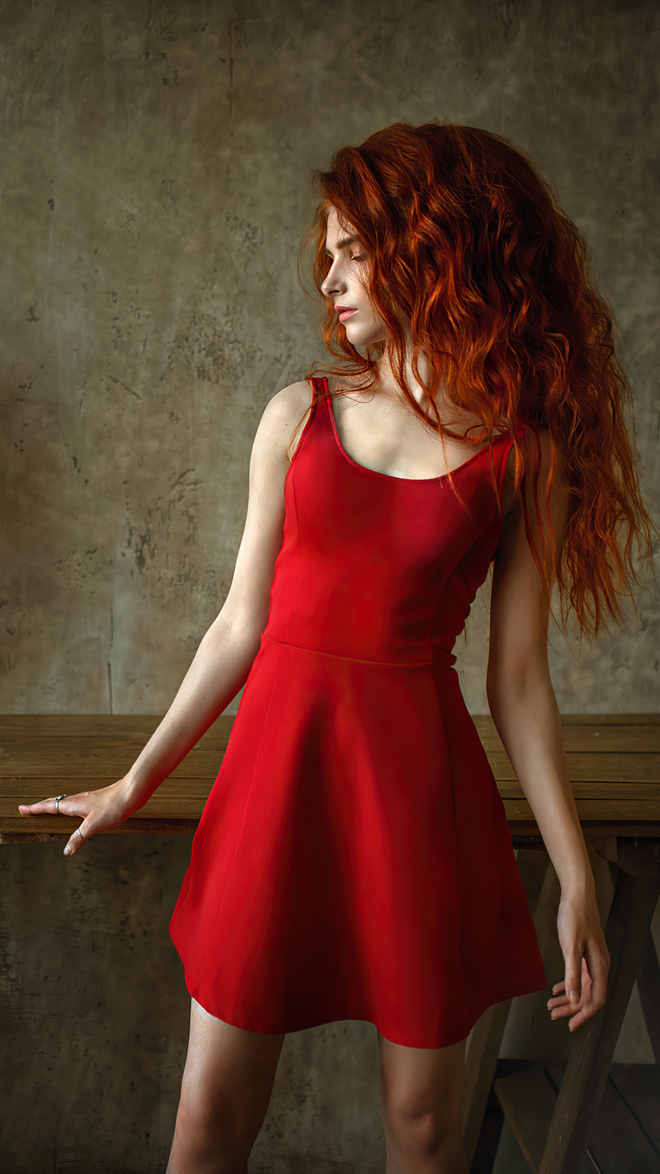 Model with long red hair in a red dress HD Phone Wallpaper