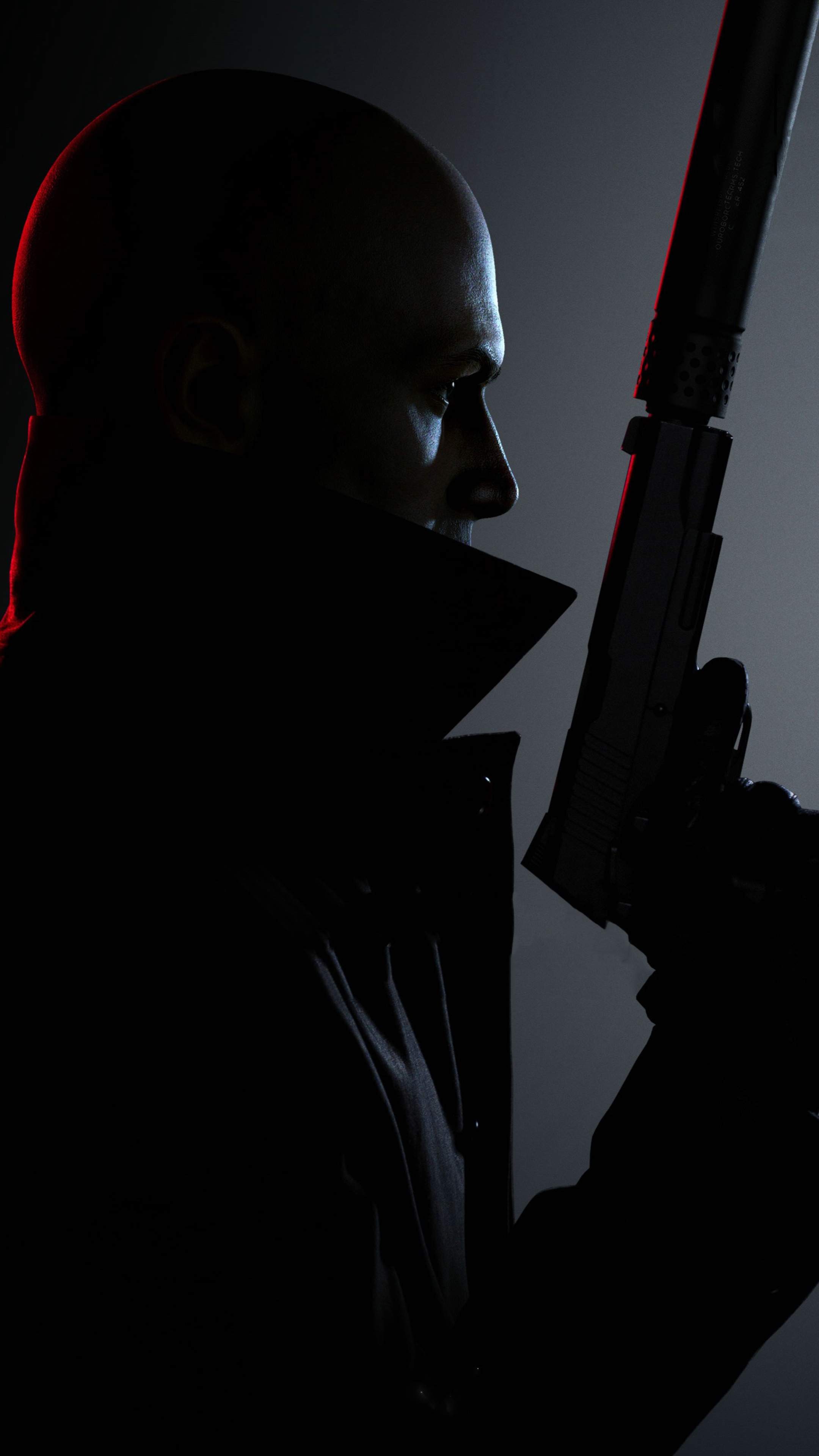 Agent 47 from Hitman 3 holding a silenced pistol HD Phone Wallpaper
