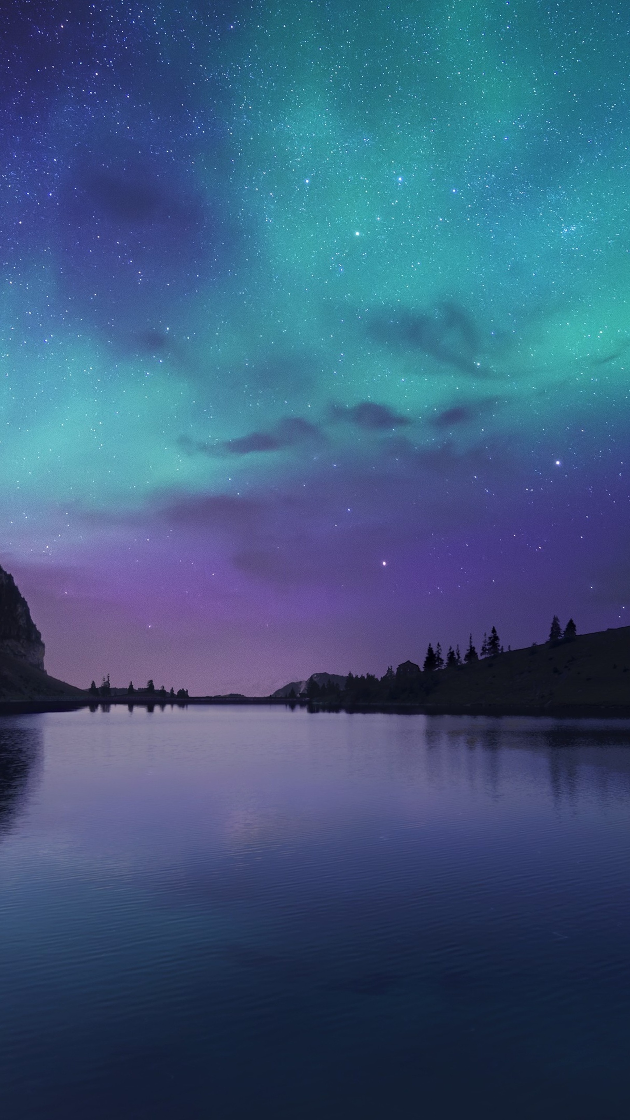 Aurora Borealis over a calm lake with mountains HD Phone Wallpaper