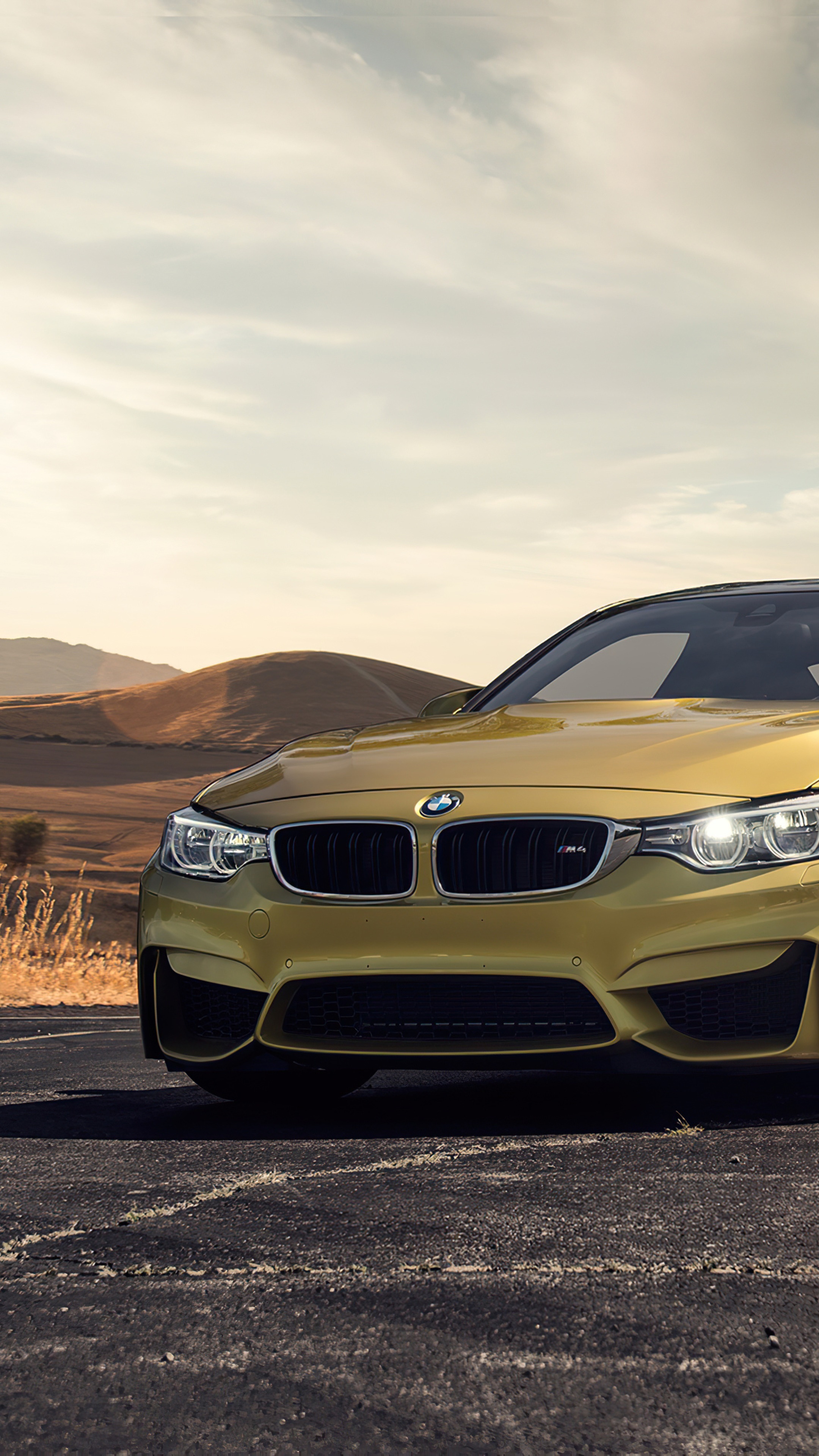 Yellow BMW M4 in a Desert Landscape HD Phone Wallpaper