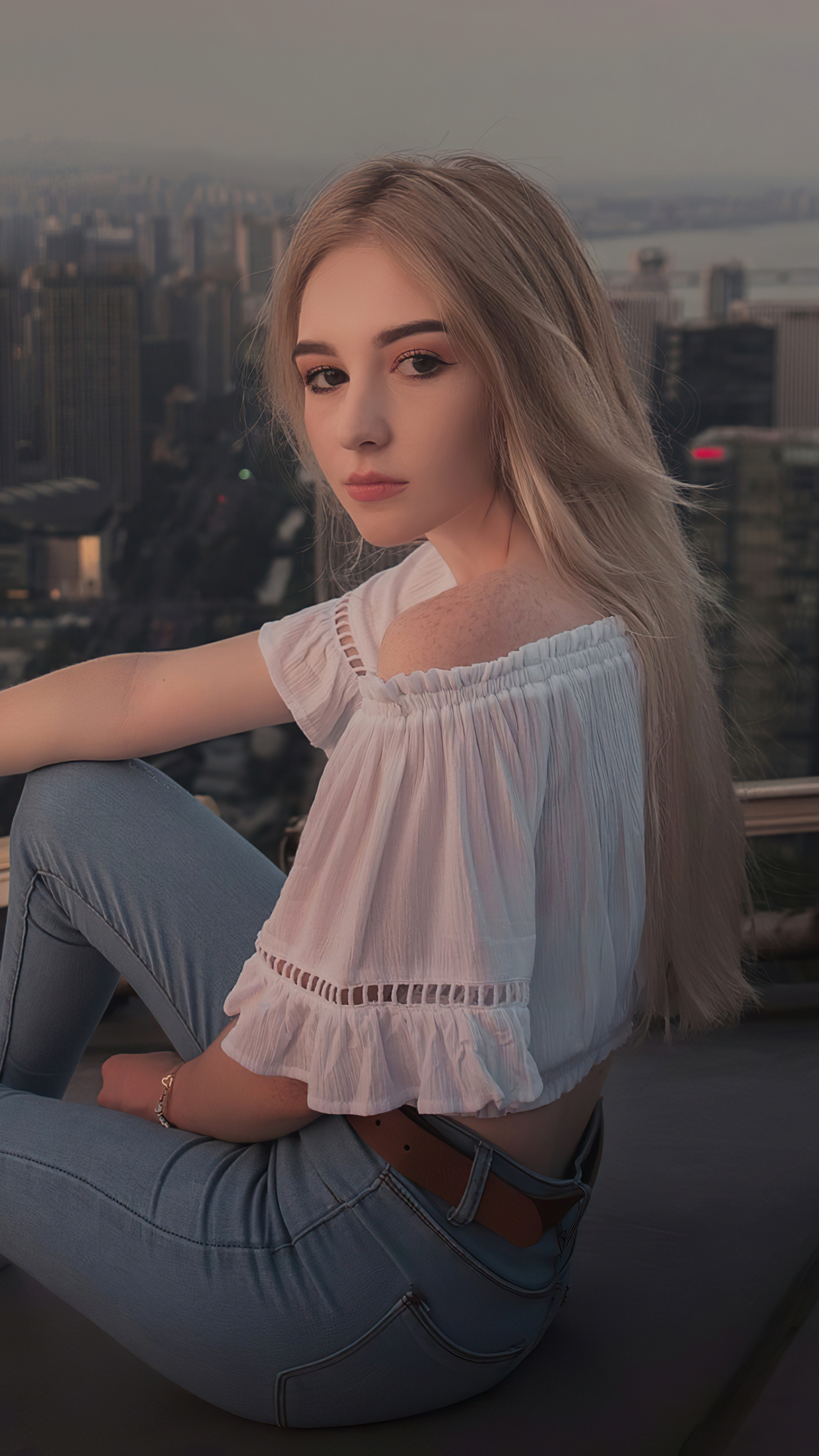 Blonde girl in white top and jeans on rooftop HD Phone Wallpaper
