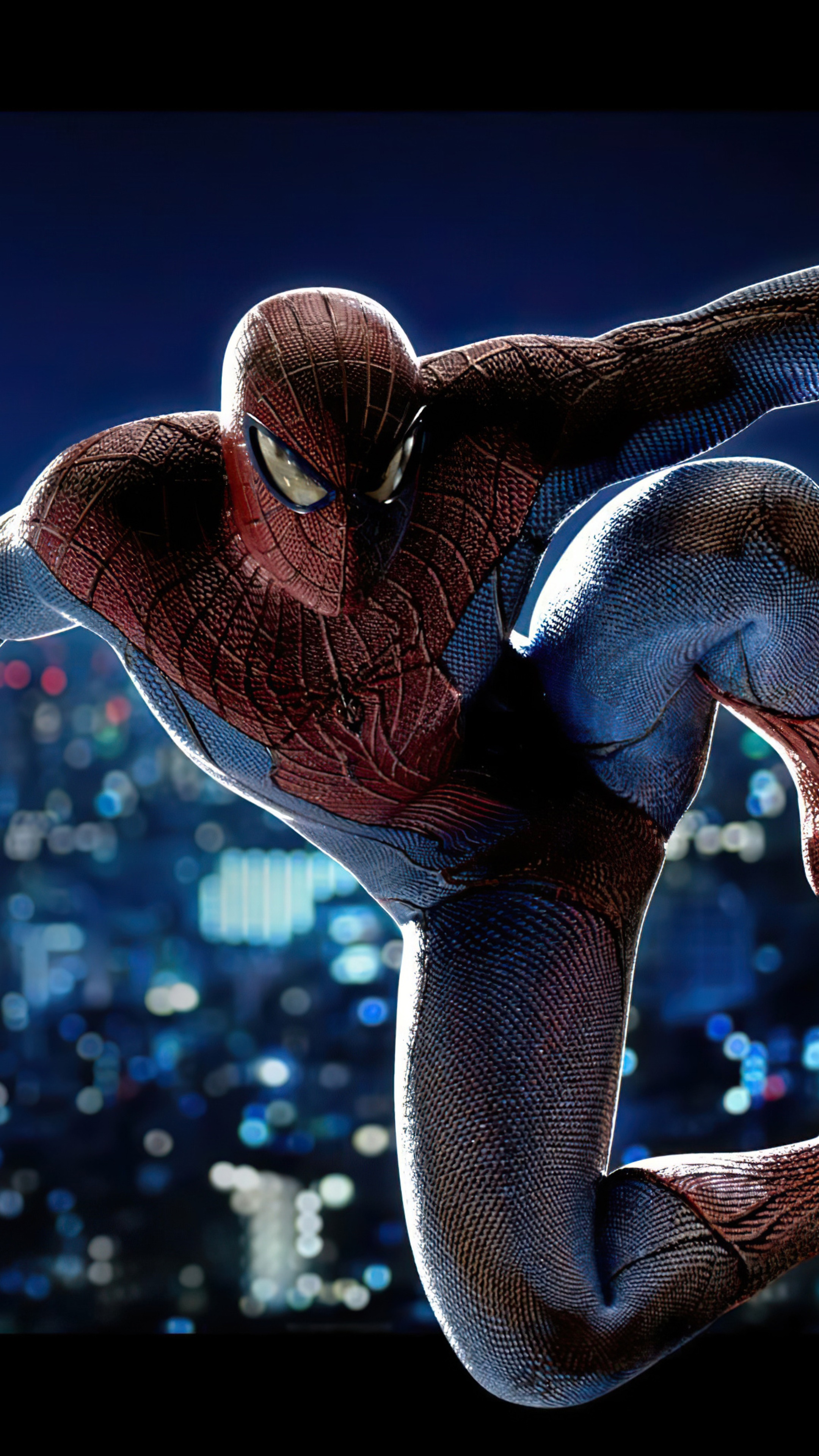 Spider-Man in a dynamic pose against a city skyline HD Phone Wallpaper