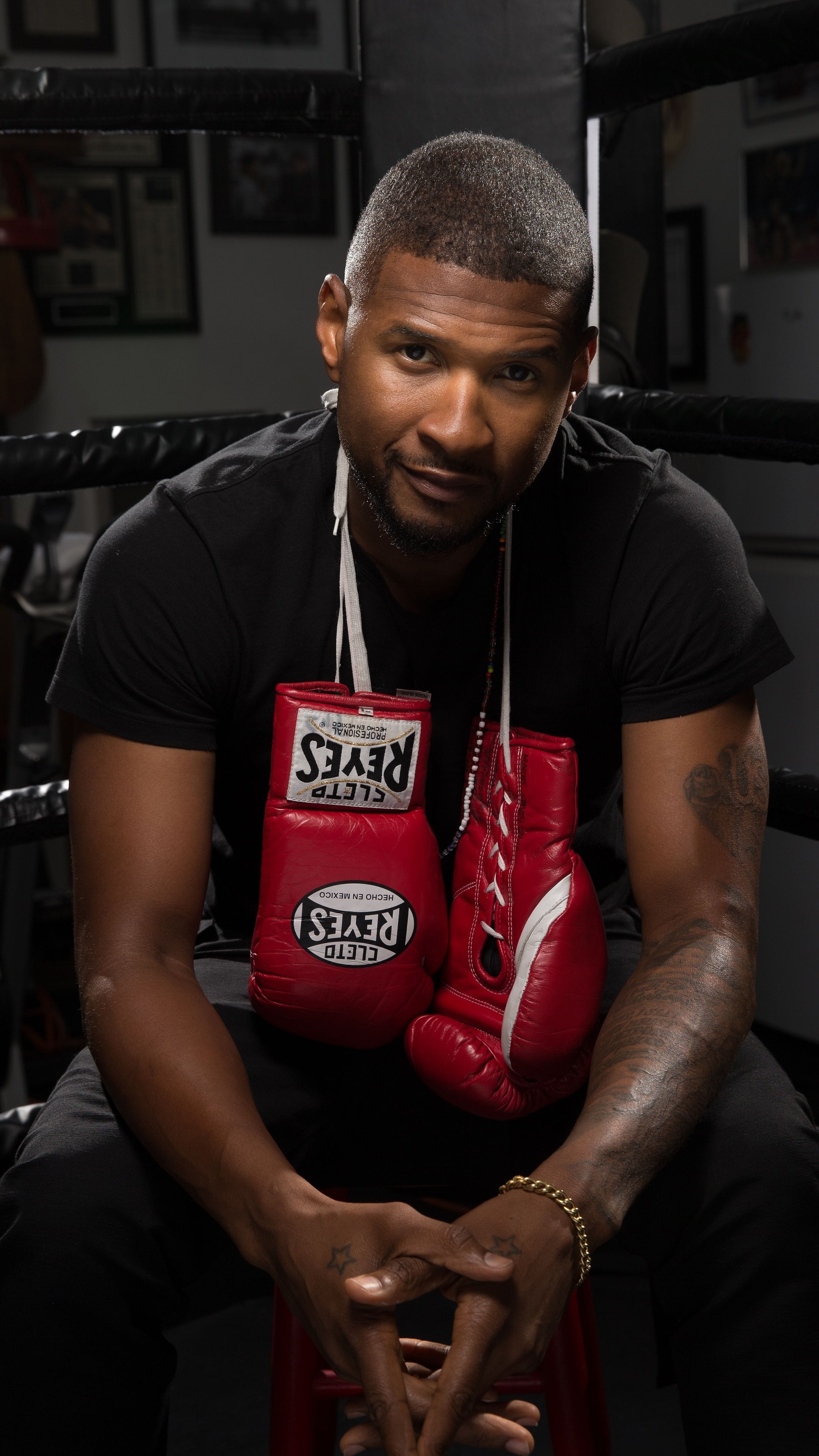 Usher in a boxing ring with boxing gloves HD Phone Wallpaper