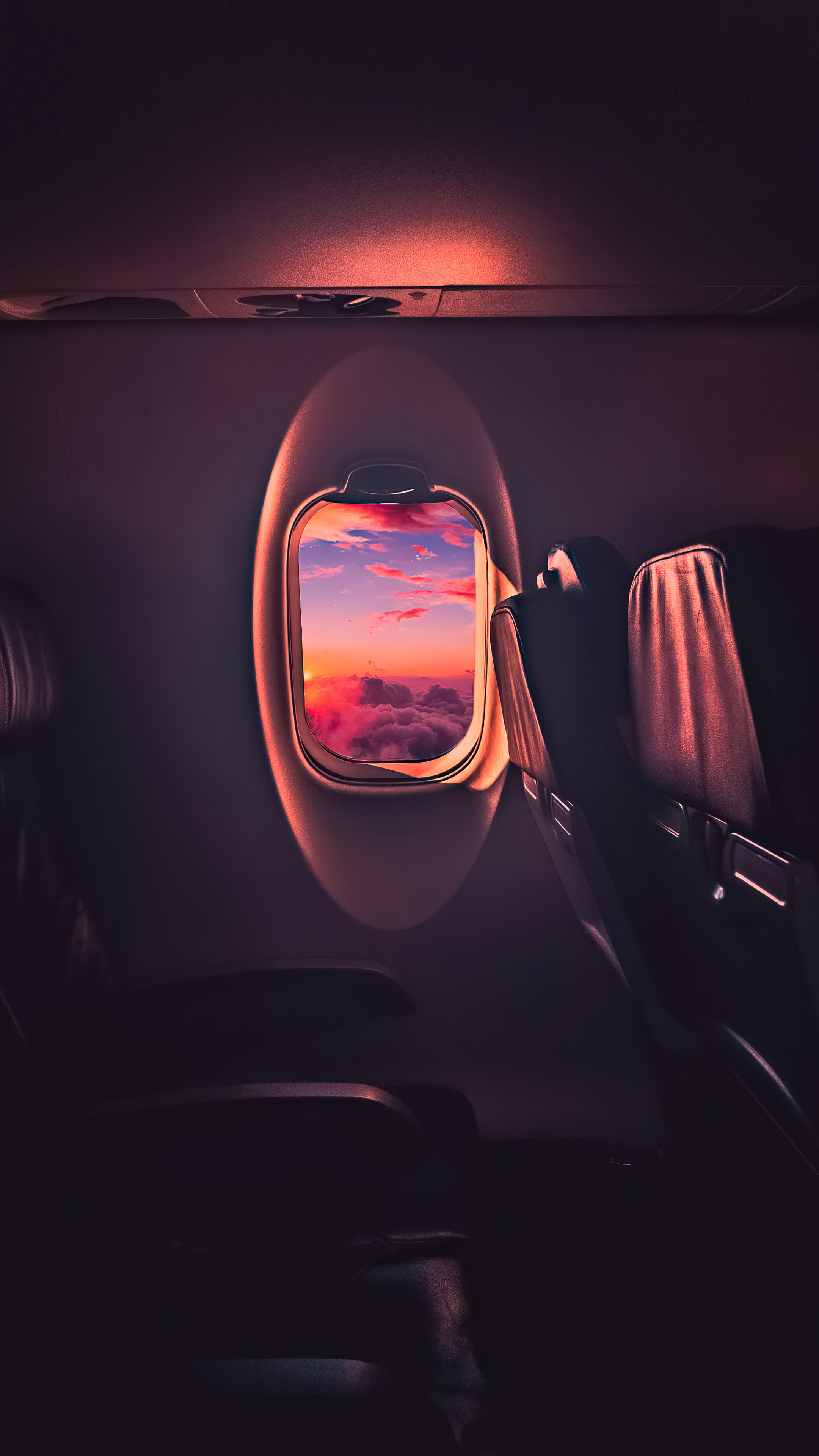 Airplane window view of sunset over clouds HD Phone Wallpaper