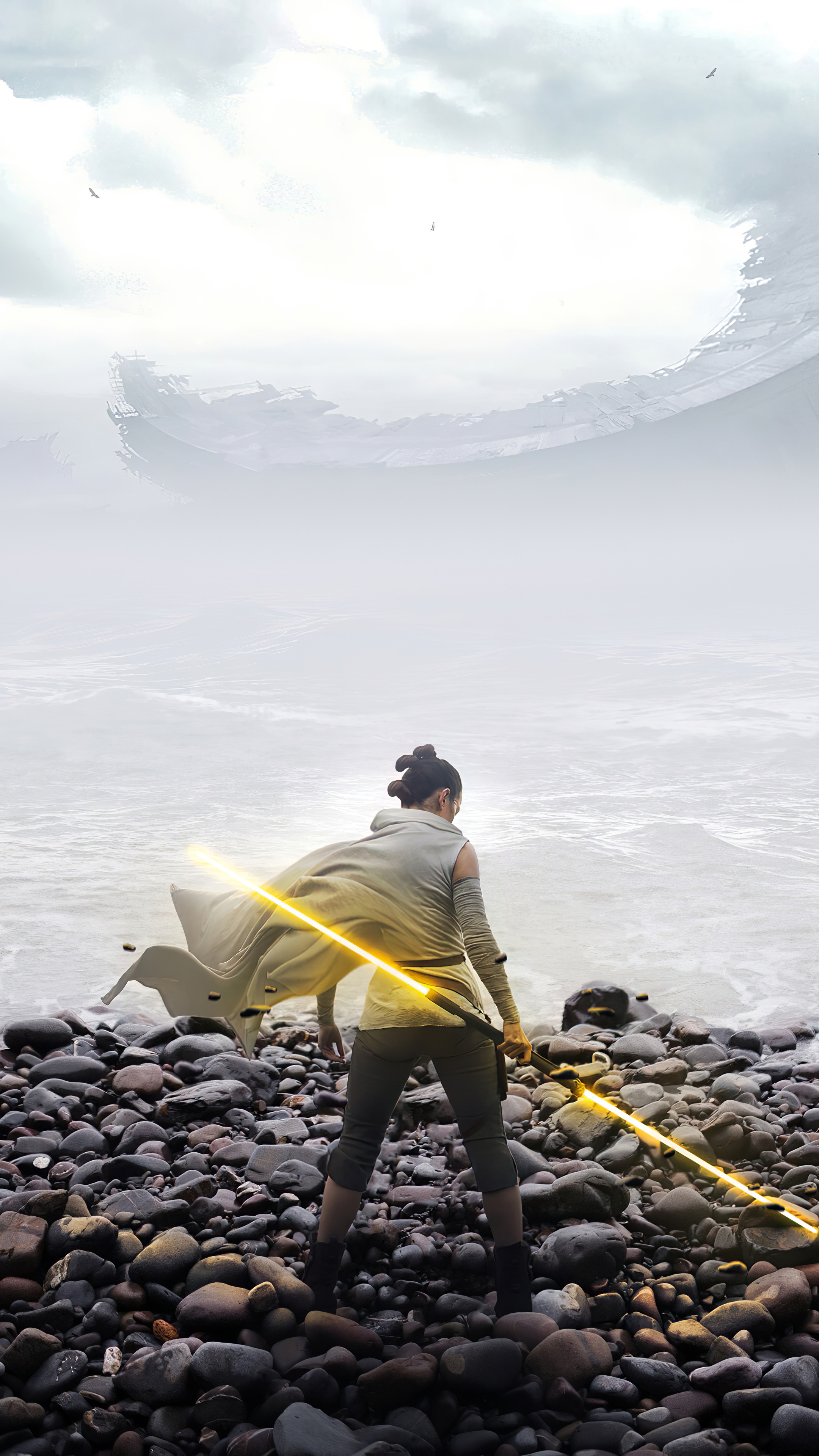 Rey from Star Wars with a lightsaber on a rocky shore HD Phone Wallpaper